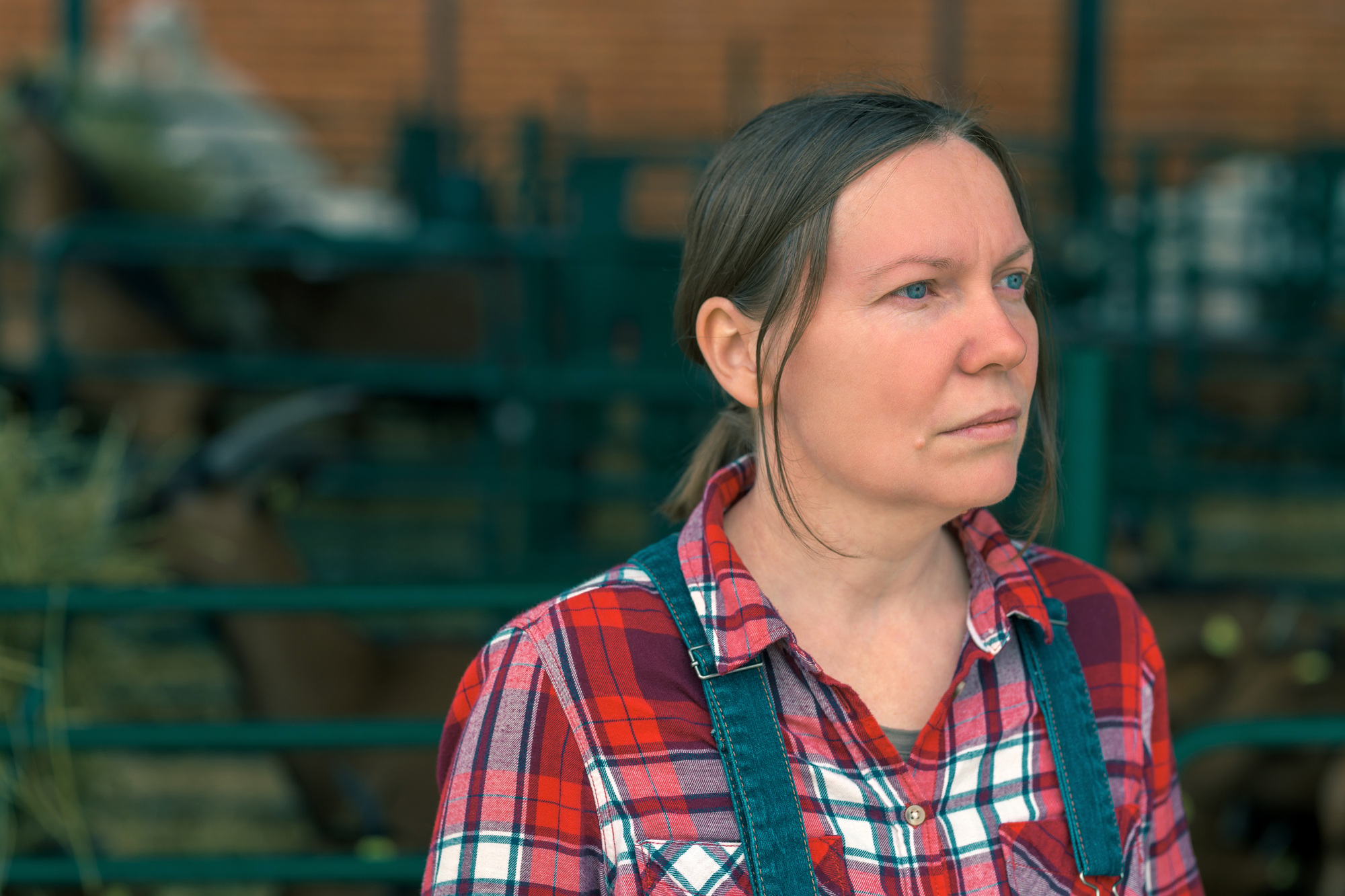 Female farmer posing on goat farm