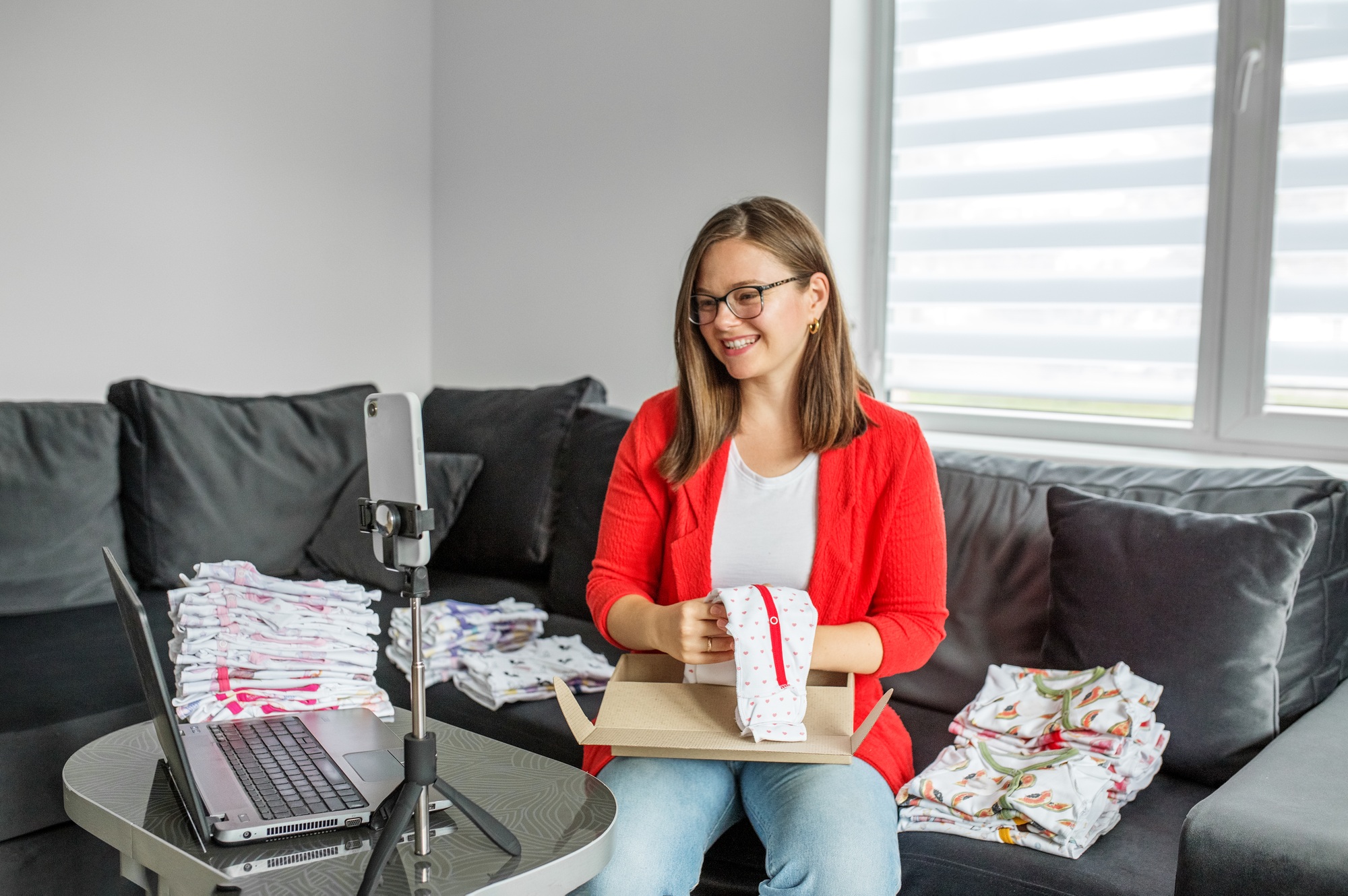Female owner of an independent online baby clothing store. Digital business. Workplace.