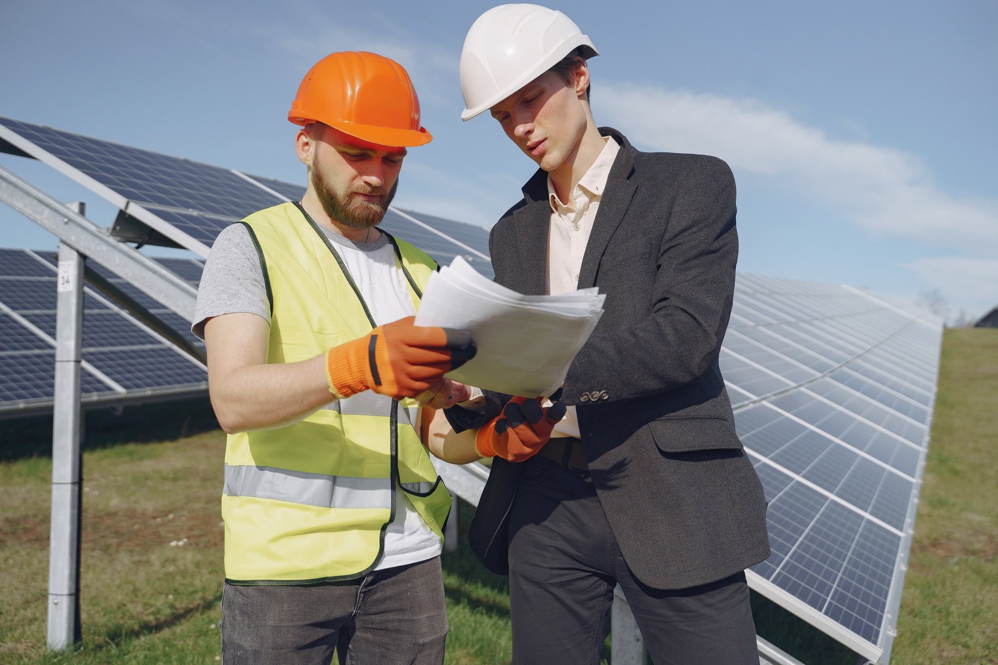 Foreman and businessman at solar energy station