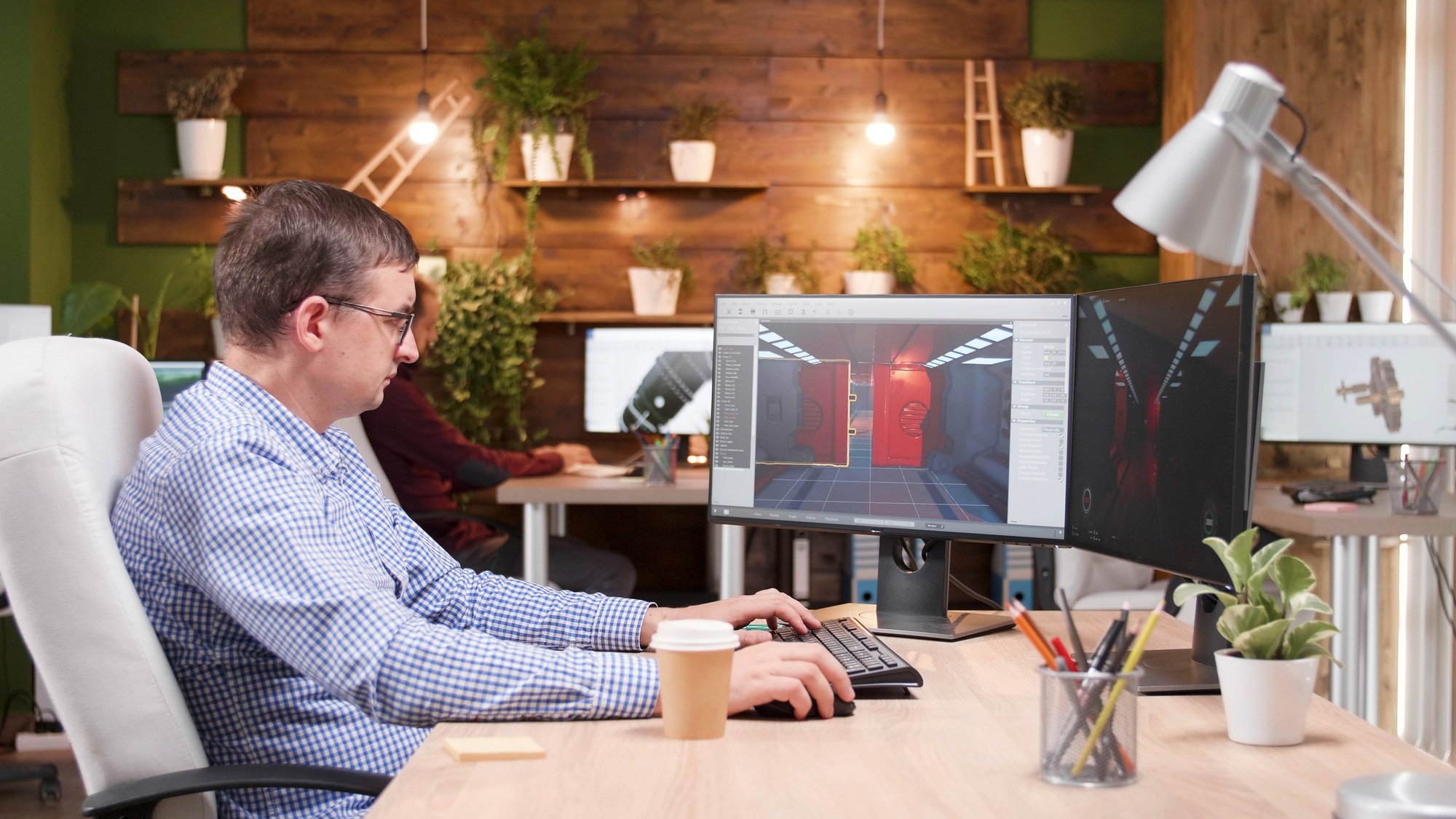 Game creator developing videogame simulation while working at level design