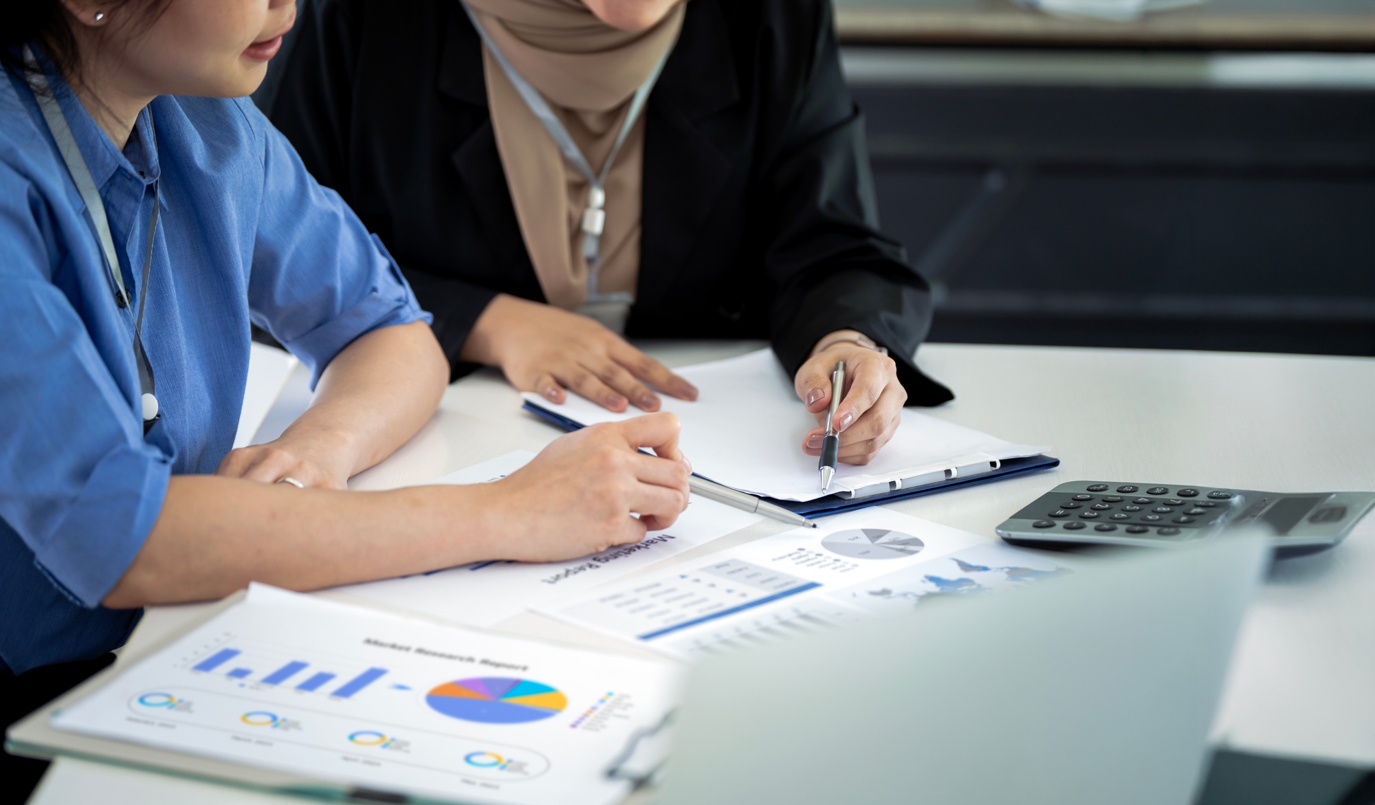 group of business people analyze market data, calculate balance sheet to plan new sales strategy.