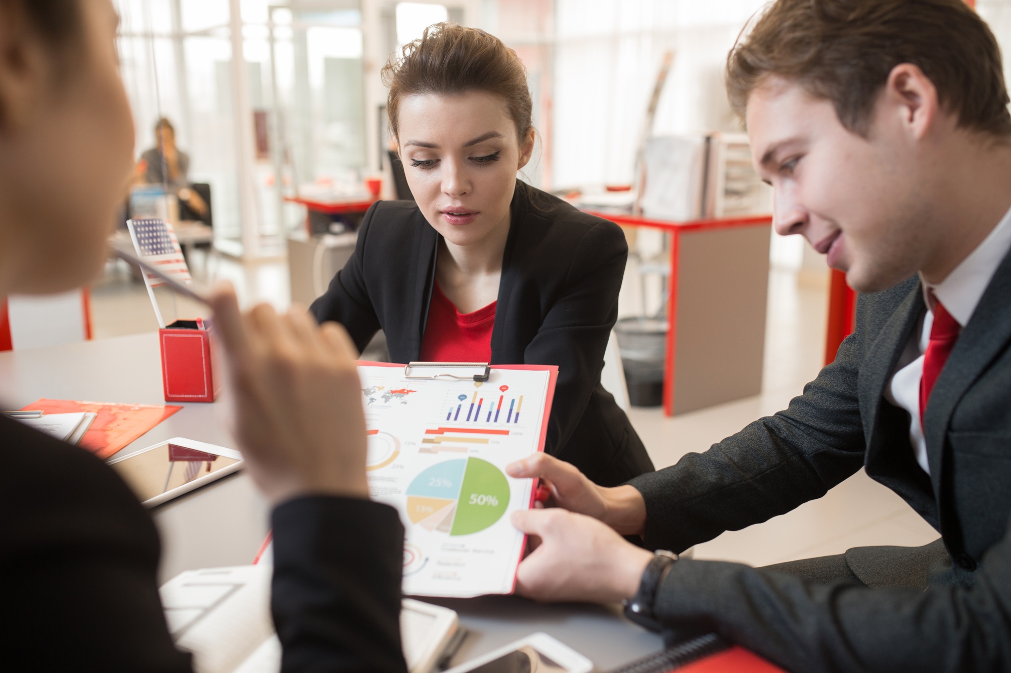 Group of People Discussing Marketing Report