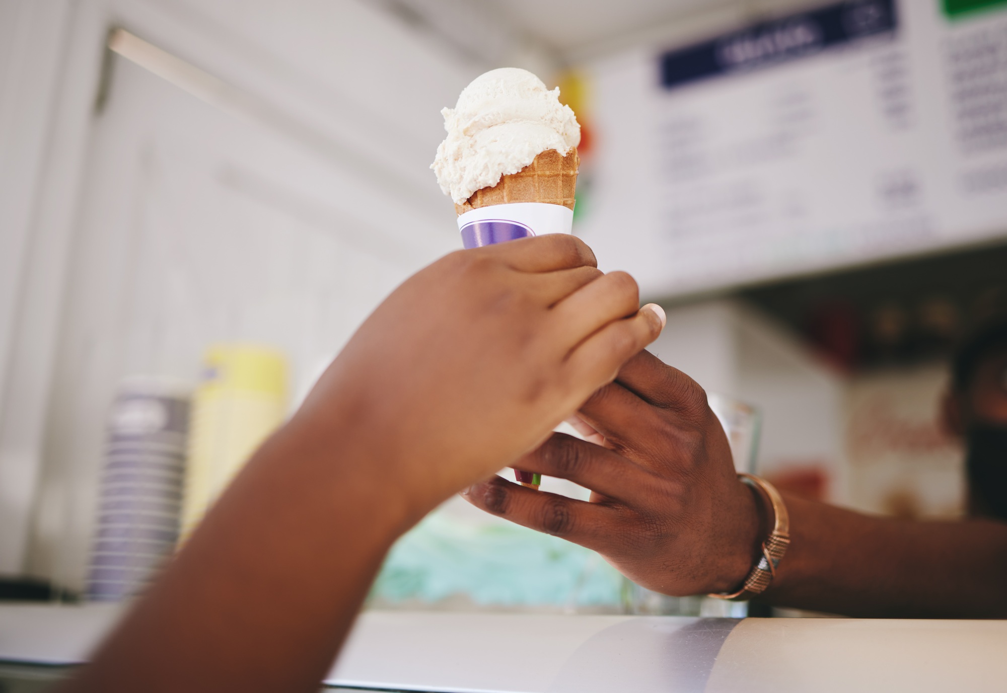 Hands, customer and ice cream for woman buying cone at local shop for small business support. Count