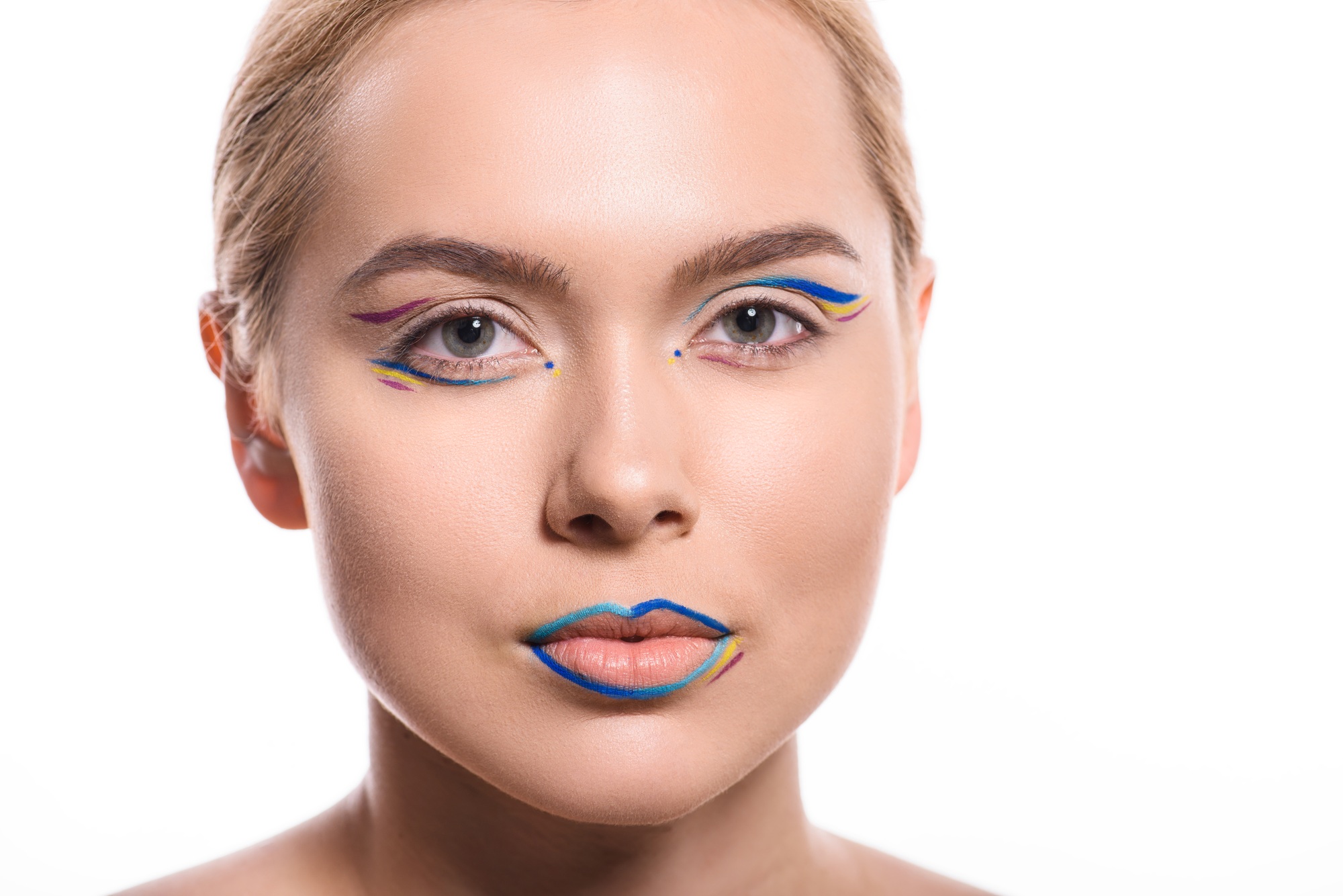 headshot of beautiful woman with colored makeup with lines isolated on white