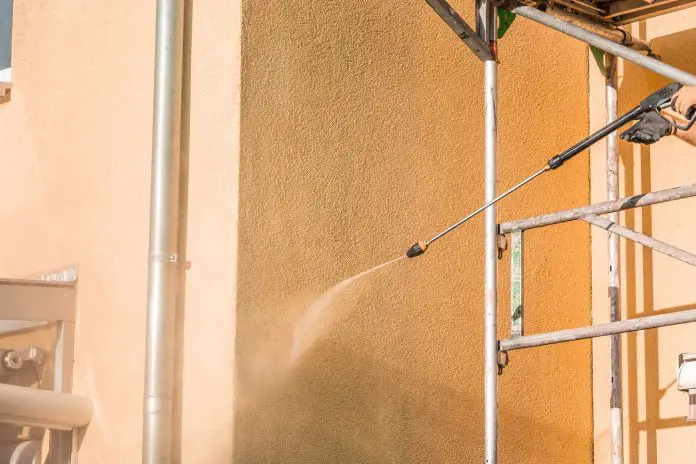 House front washing, cleaning with high-pressure water blaster