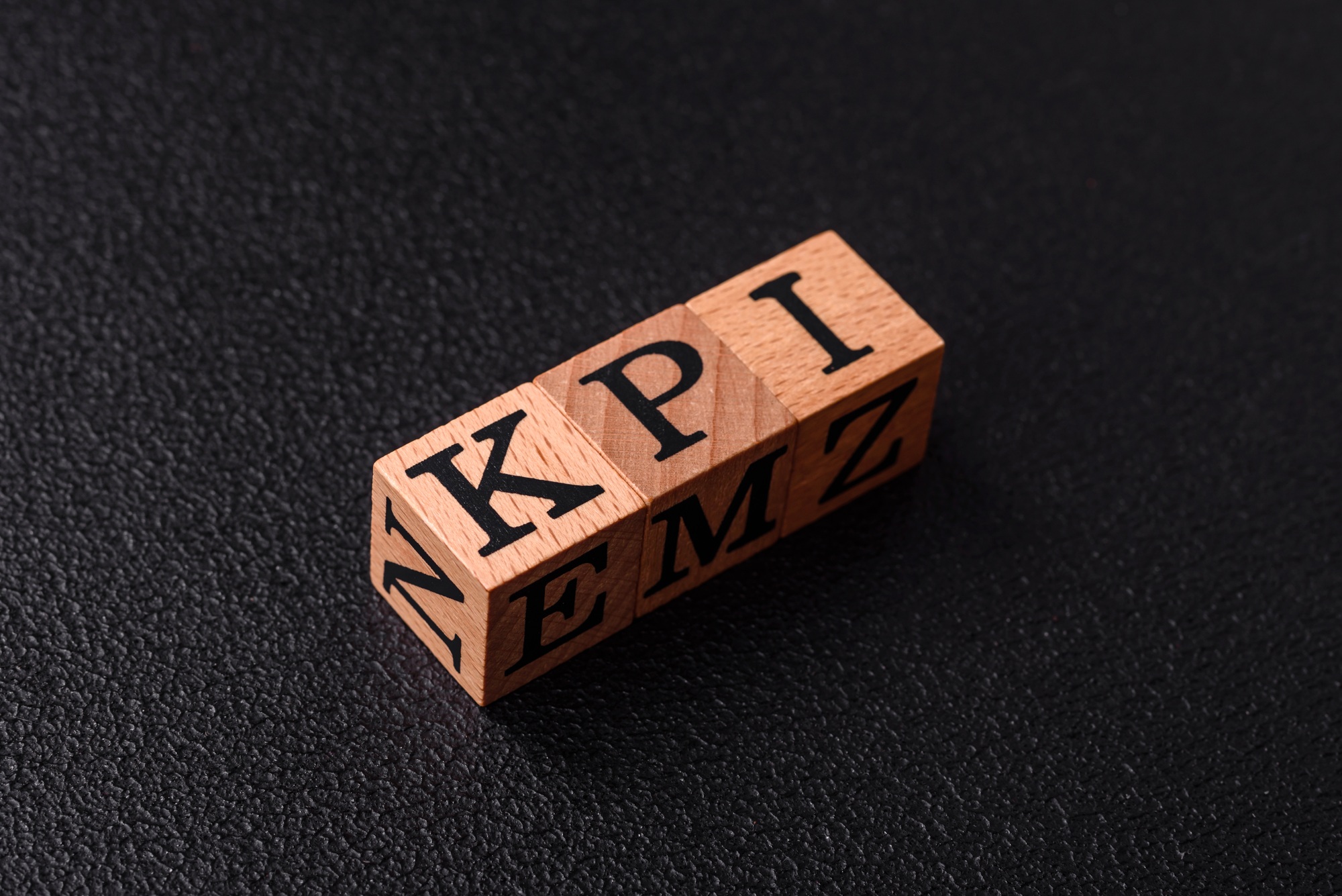 Inscription KPI Key Performance Indicator with wooden cubes