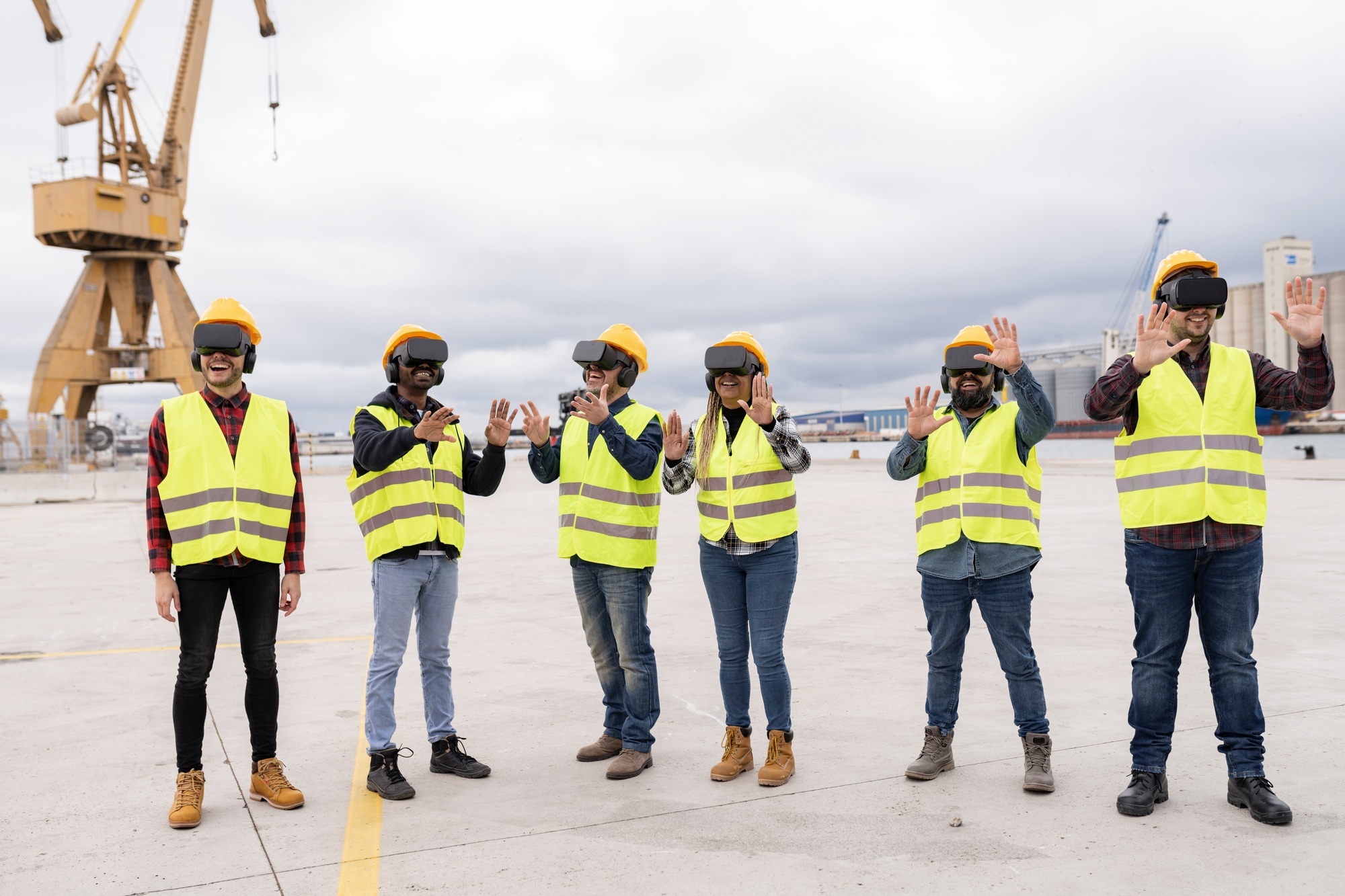large group of coworkers shipping in container with virtual reality glasses - gamification concept