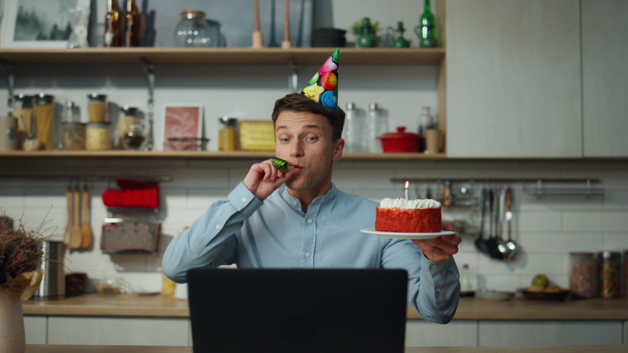 Man enjoy virtual birthday holding cake blowing candle closeup. Guy celebrating.