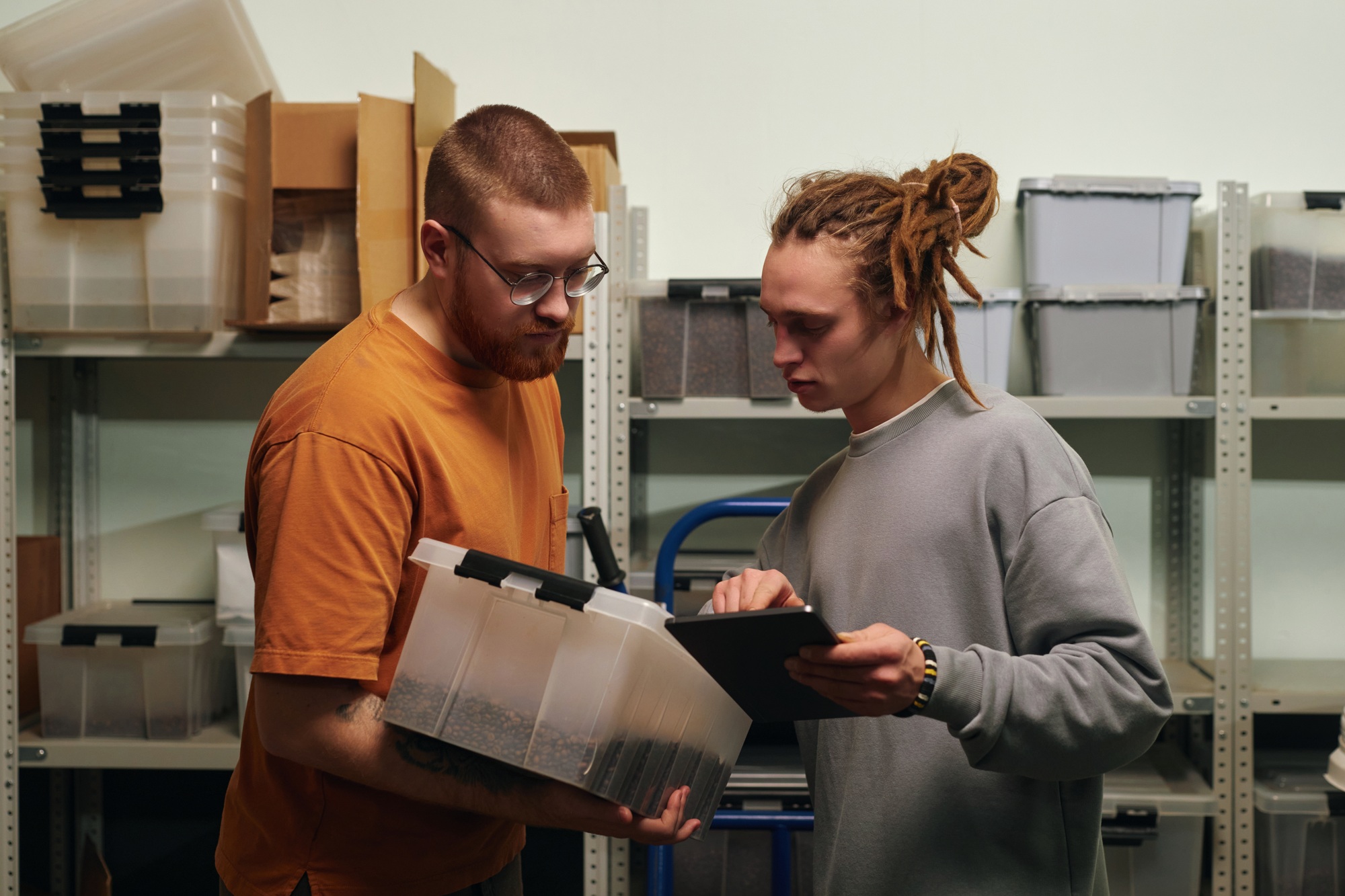 Men Comparing Coffee Brand Written on Box