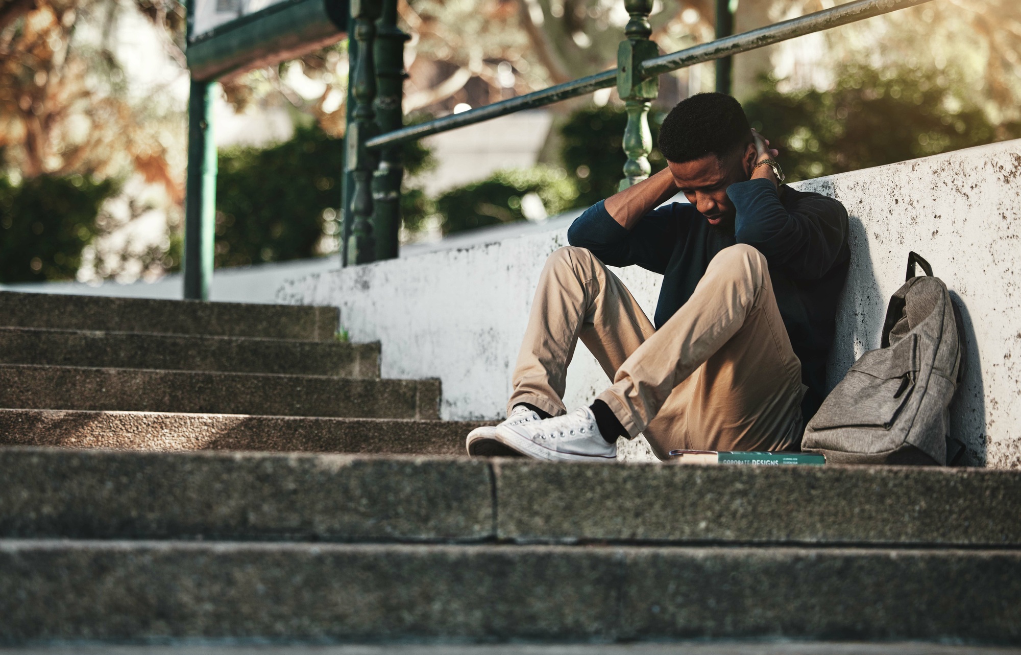 Mental health, depression and anxiety with student on stairs with backpack for failure, fear and mi