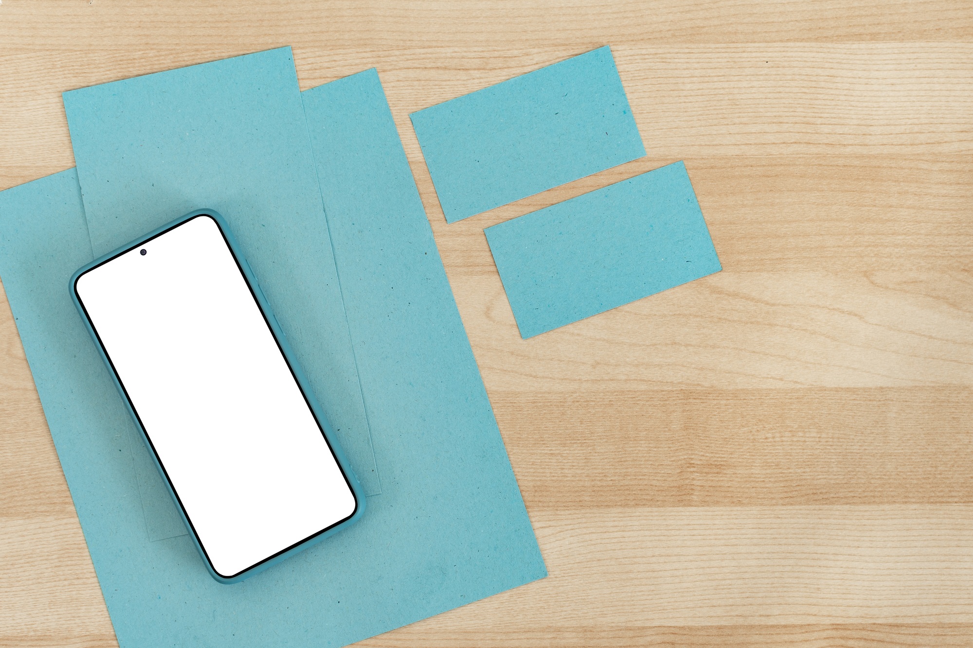 Mockup image of mobile phone with blank screen and empty business card.