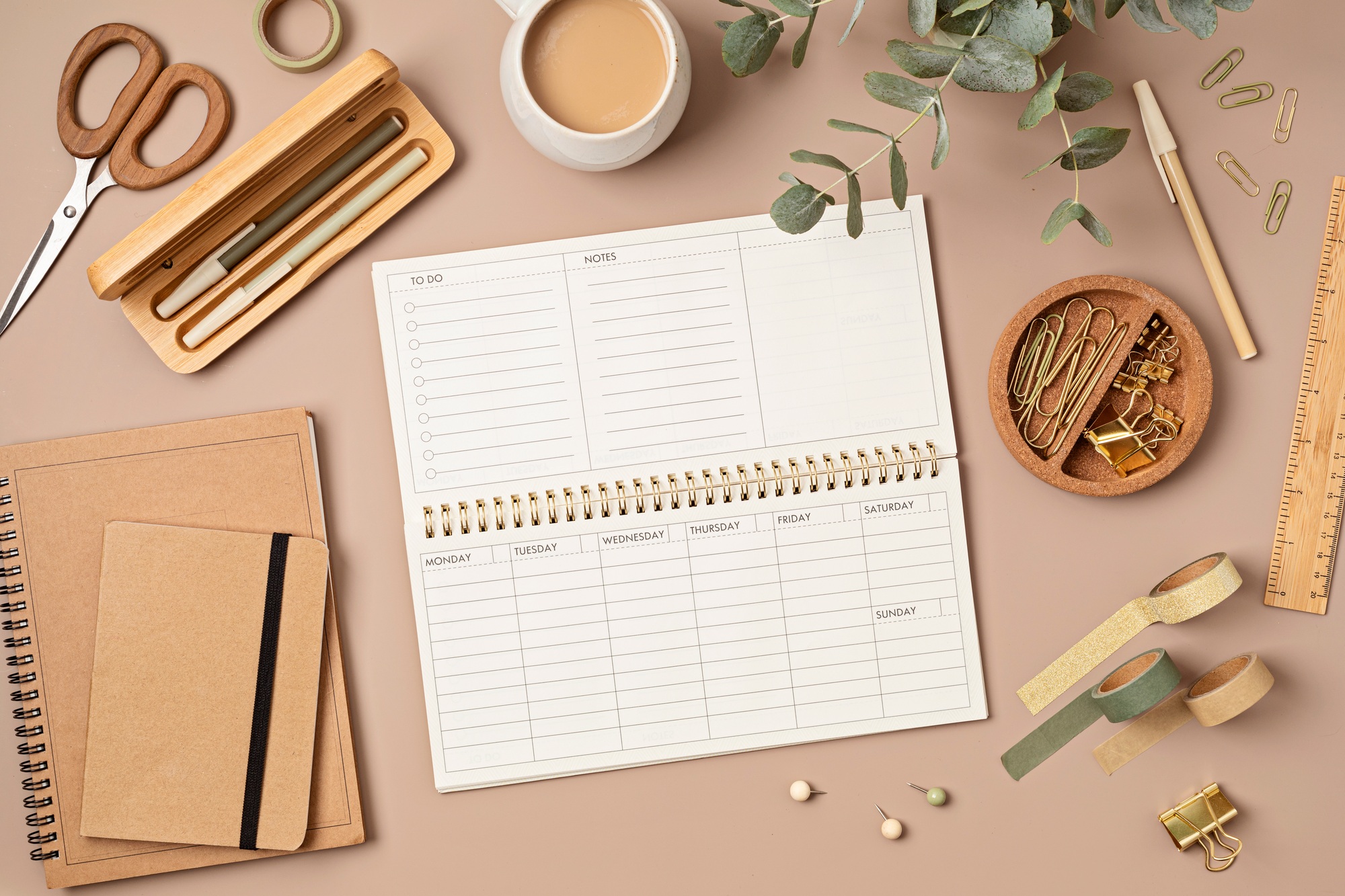 Mockup of  weekly planner and office stationery