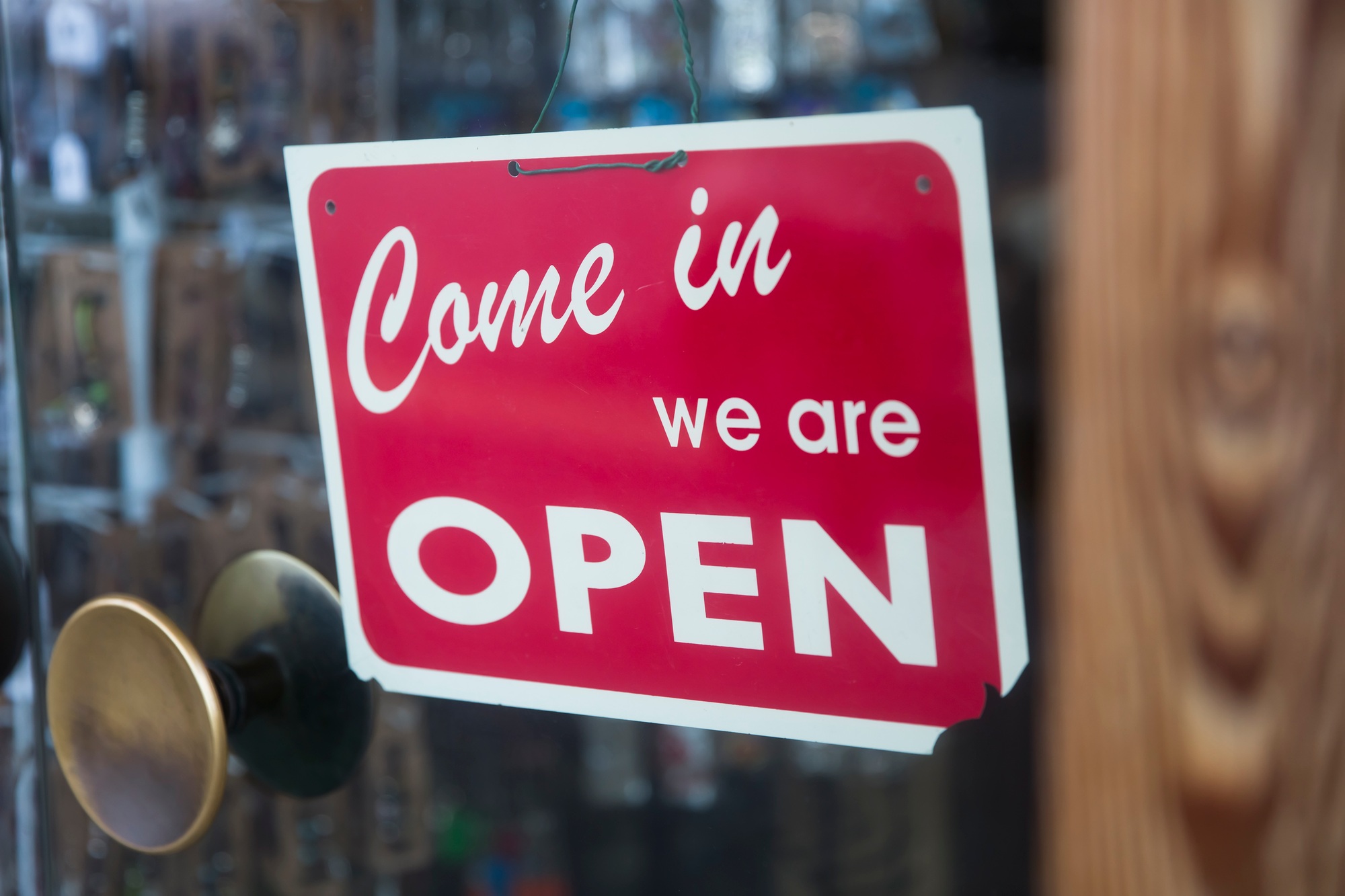 Open sign on the glass of shop or cafe window