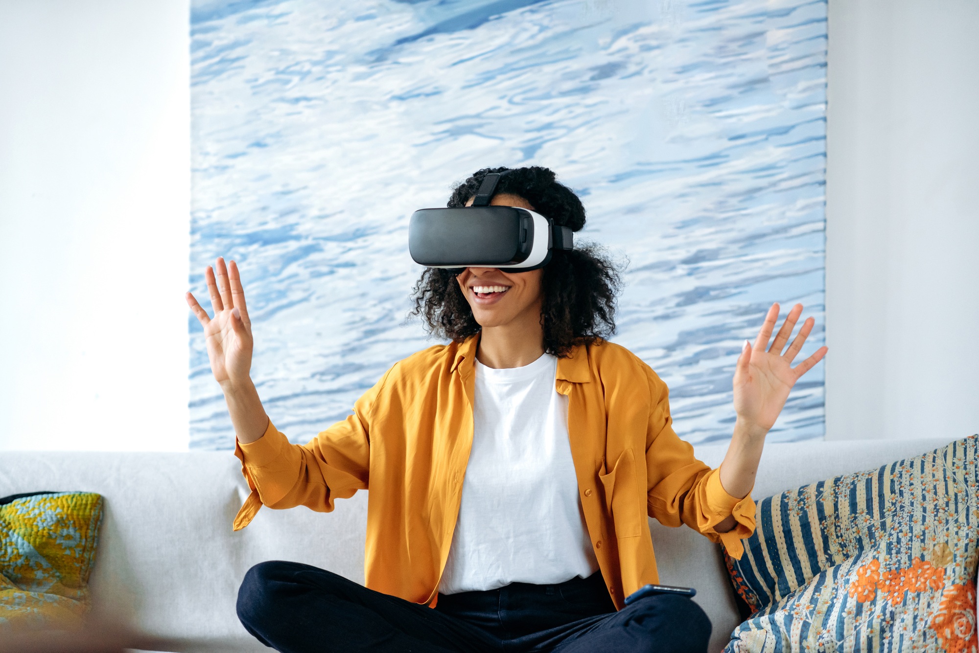 Play in virtual world. Happy cheerful african american girl using virtual reality device