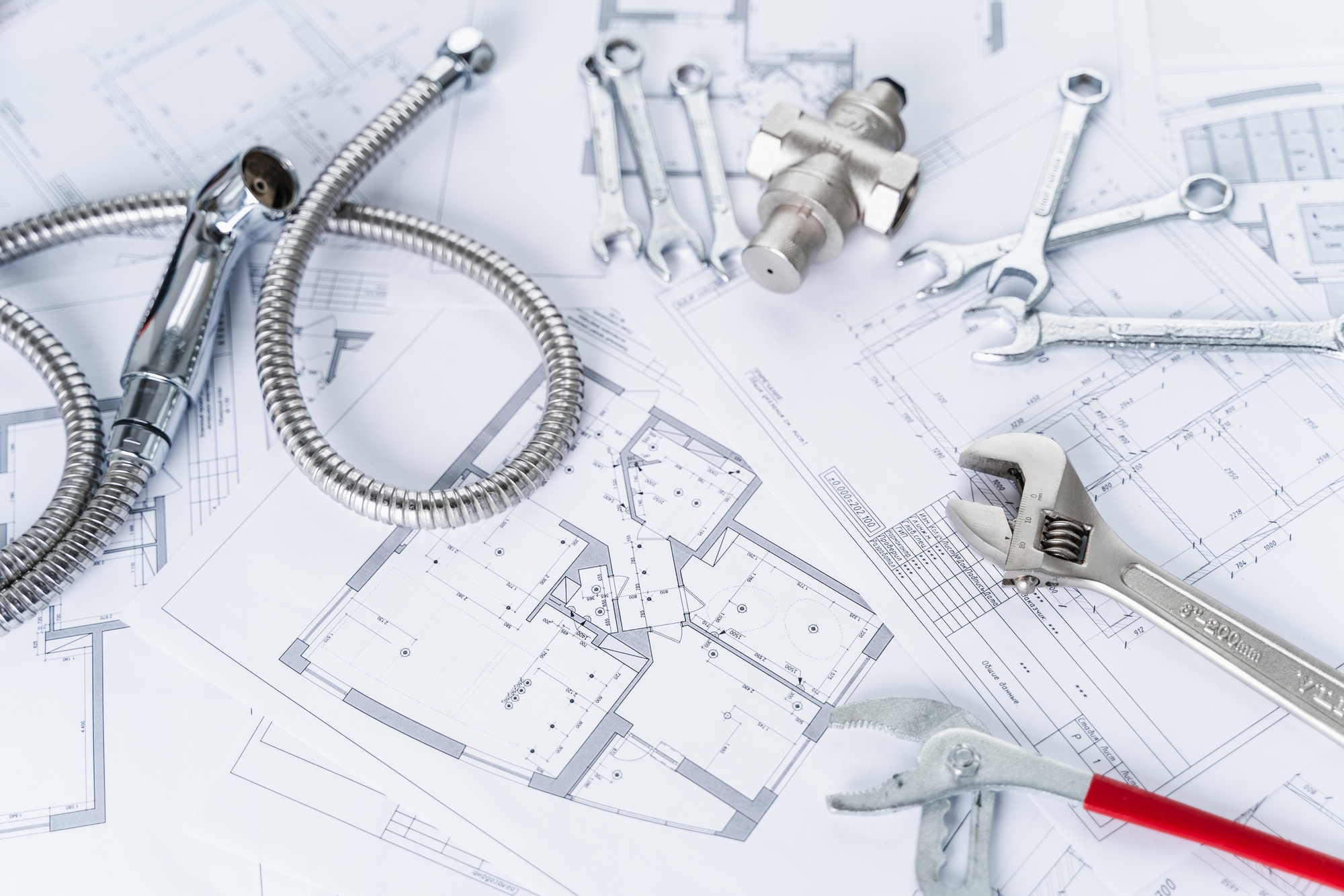 Plumbing project in house.Drawing,diagrams,plan of water supply of apartment,building.Man repairer