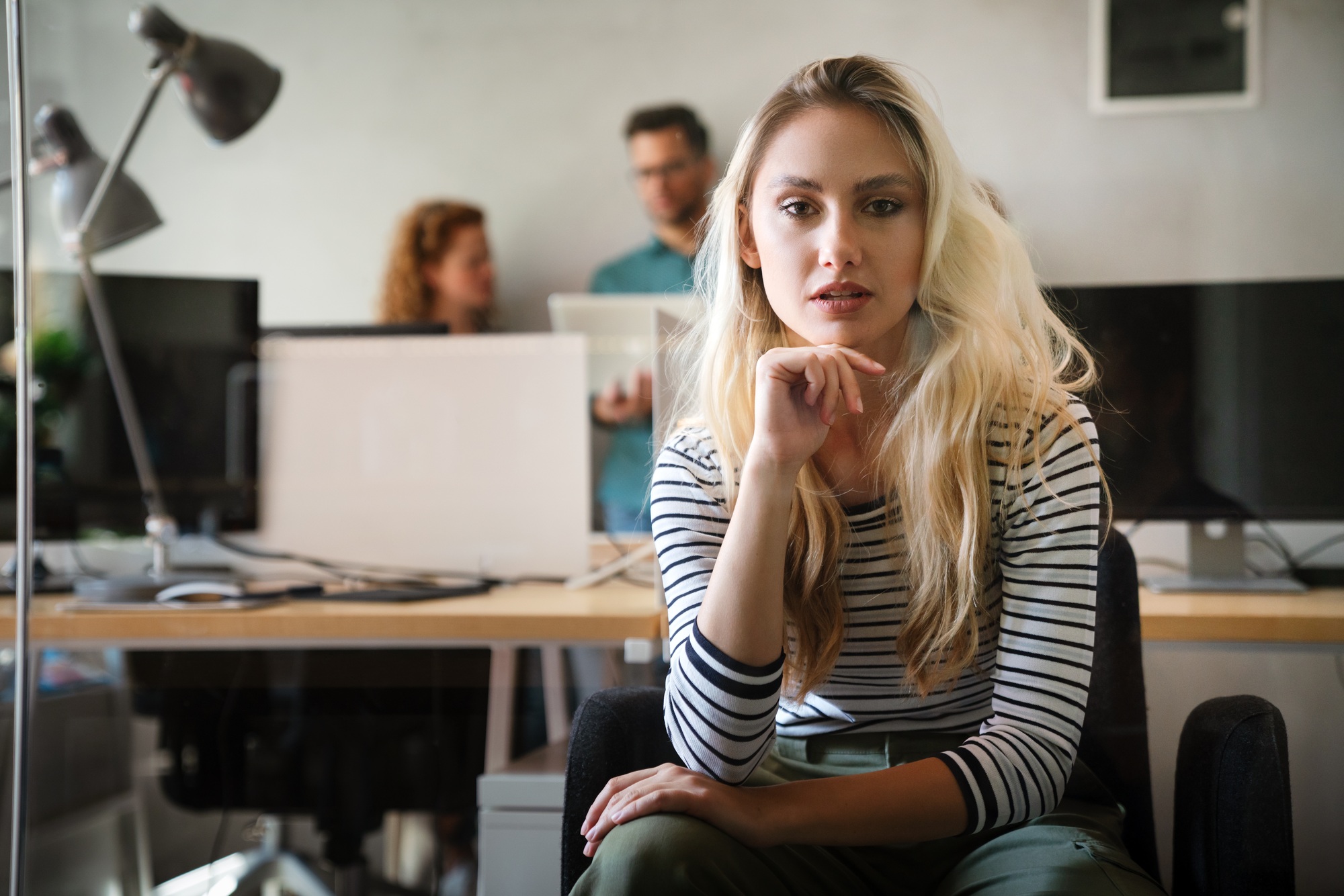 Portrait of attractive skilled experienced girl database editor at workplace workstation indoors