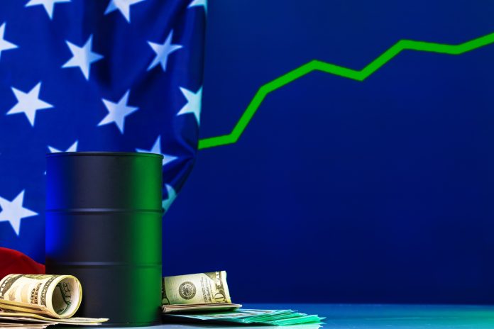 Price of american oil is changing concept. Black barrel with oil and graph