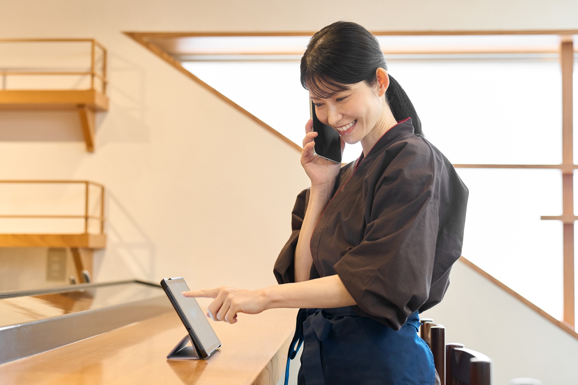 Restaurant employee managing using a tablet