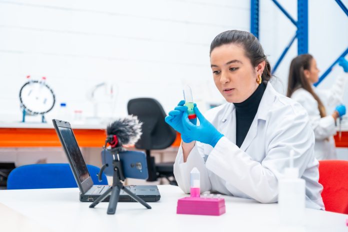 Scientist recording a video tutorial in a research laboratory