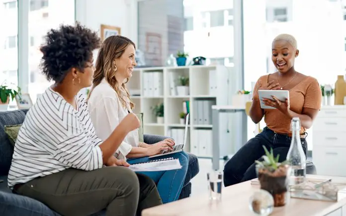 Shot of a group of businesswomen having a discussion in an office