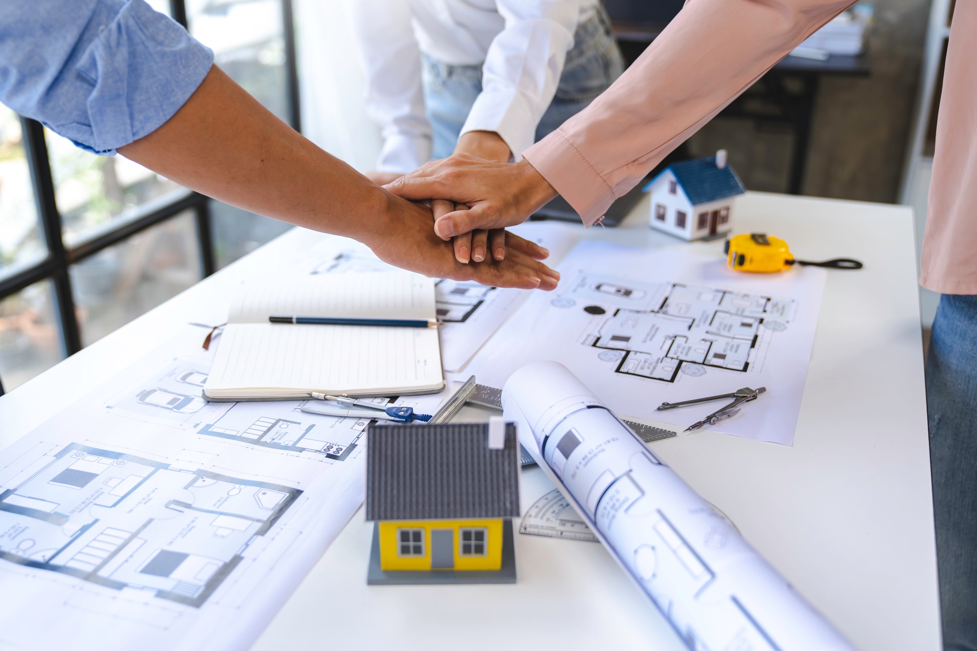 stack hands of business engineering and architect teamwork join together, construction engineer work