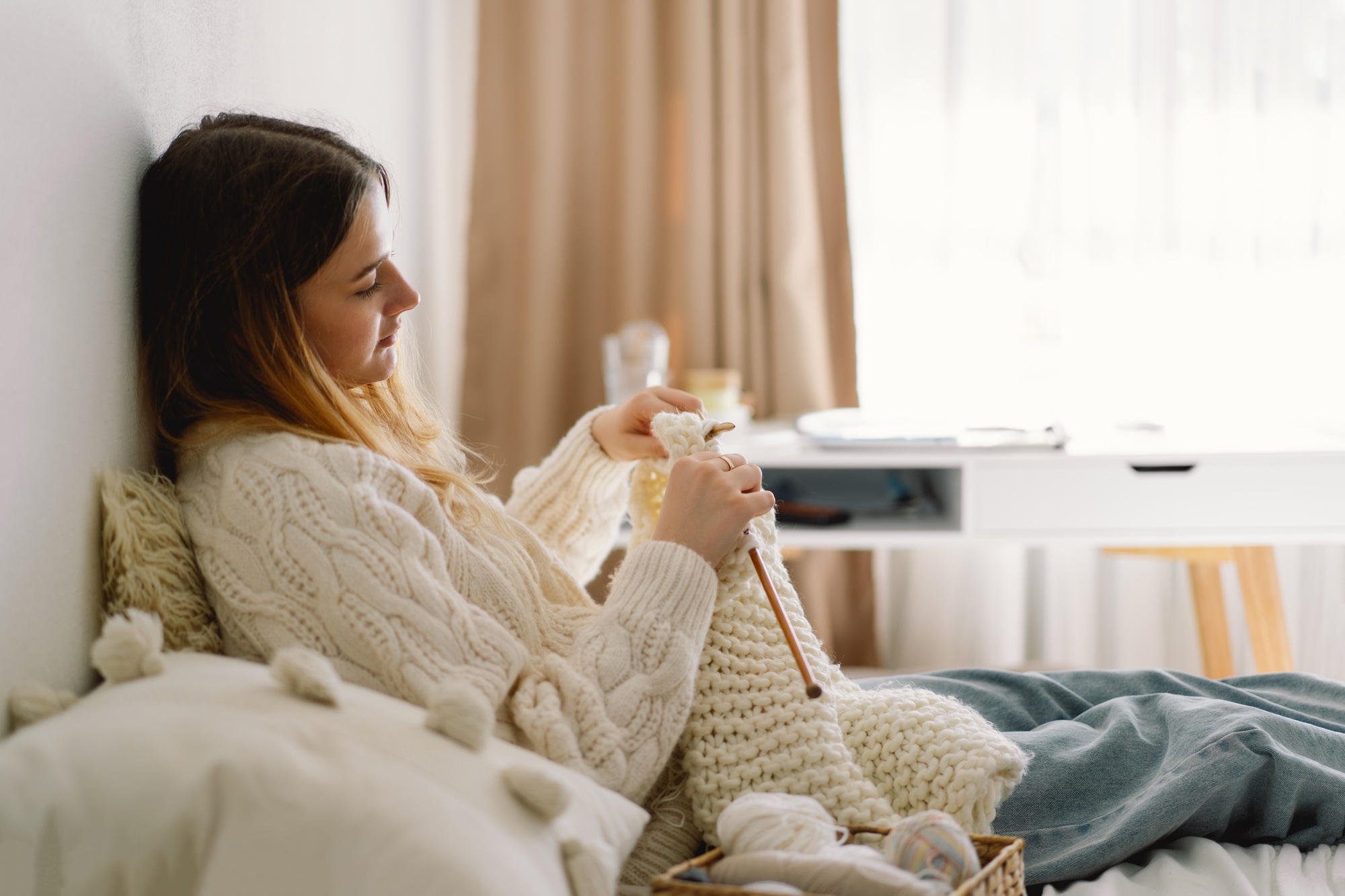 Teengirl knitting at home. Handmade and Hobby.