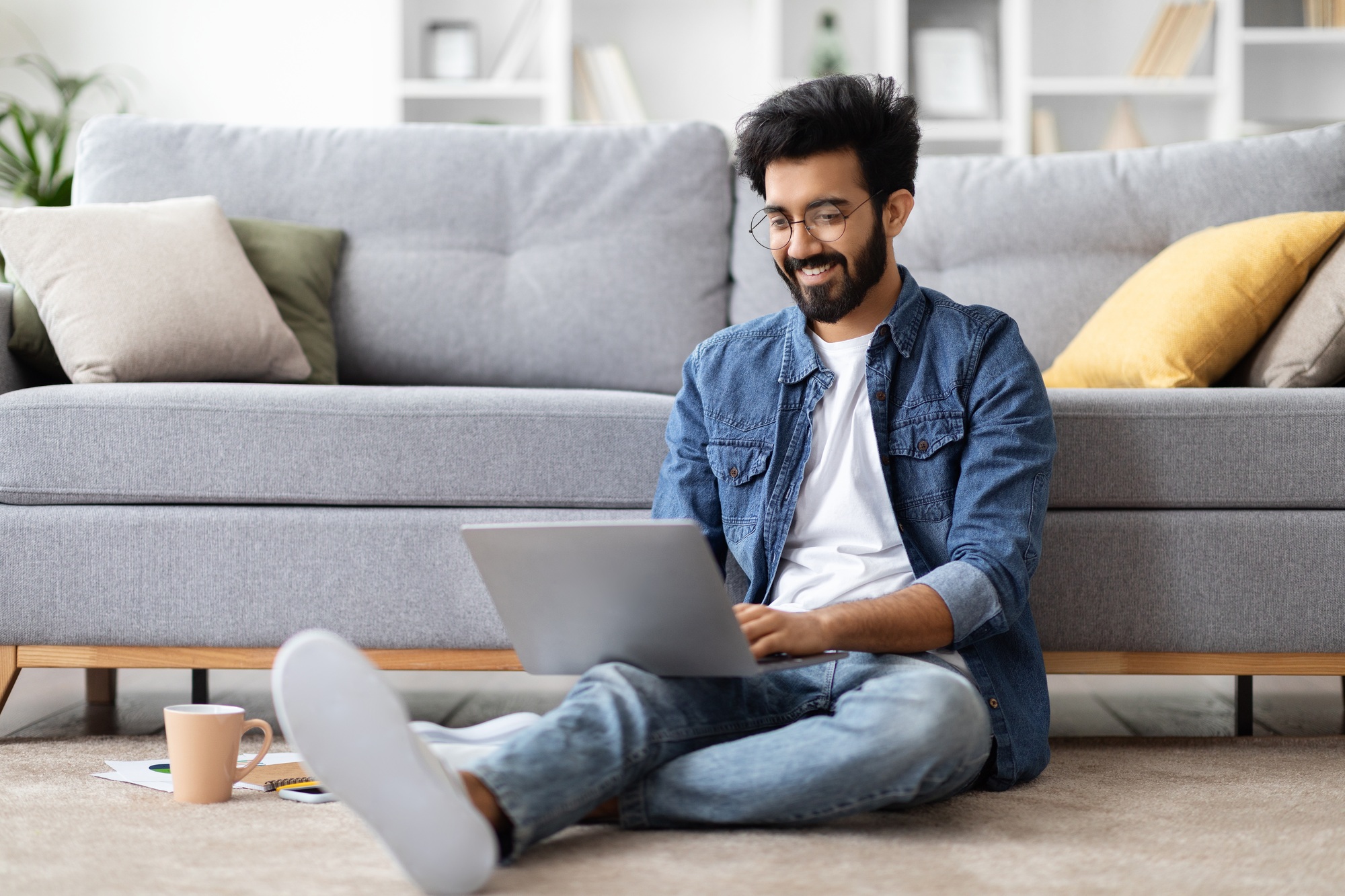 Telecommuting Concept. Young Indian Freelancer Man Working On Laptop At Home