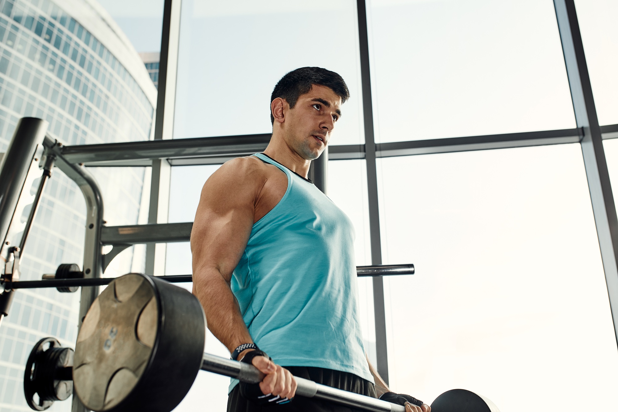 The concept of motivation, overcoming yourself and your fears, an athlete in the gym doing exercises