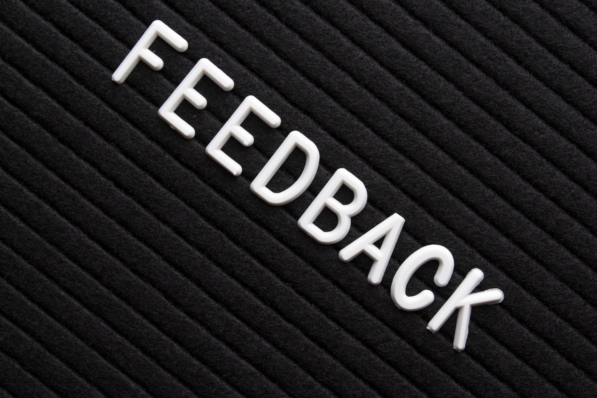 The text feedback on black letter board