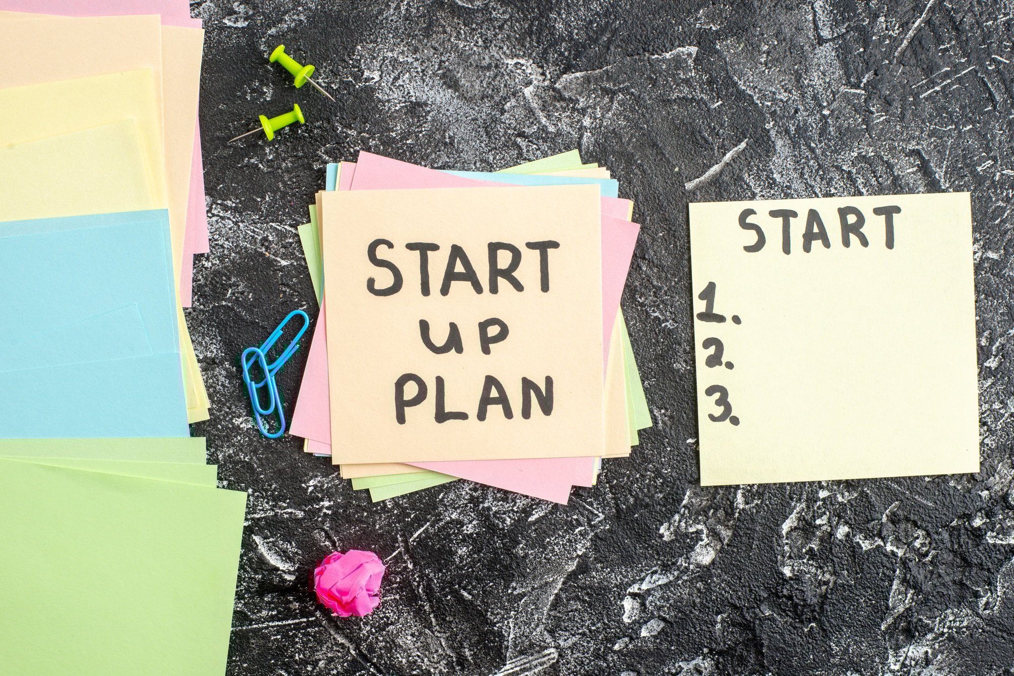 top view start up plan note on sticker on gray background lesson student note school paper sticker