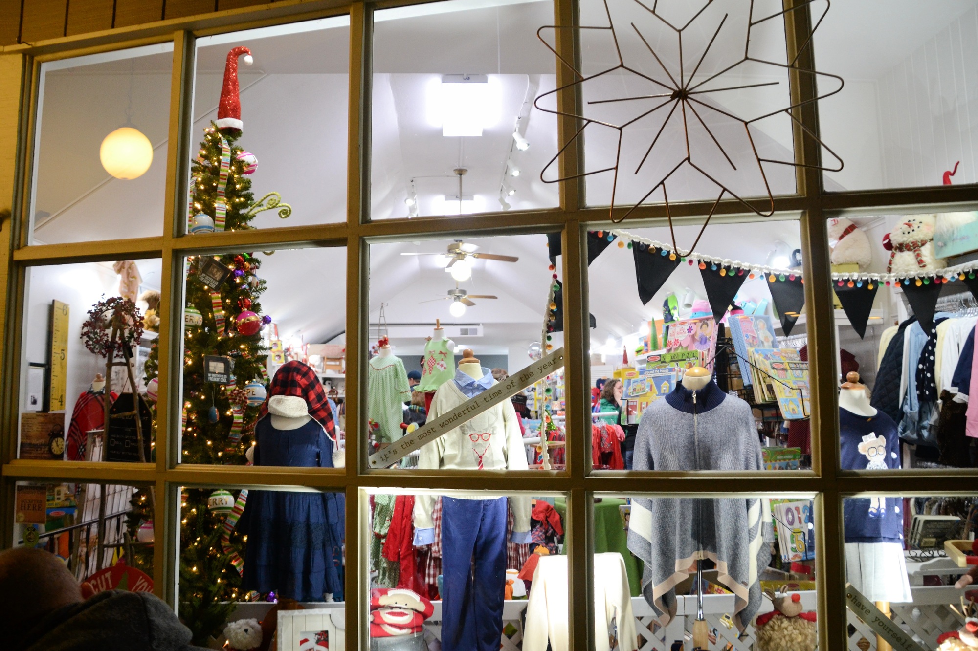 Window display at a Small local business decorated for Christmas shoppers