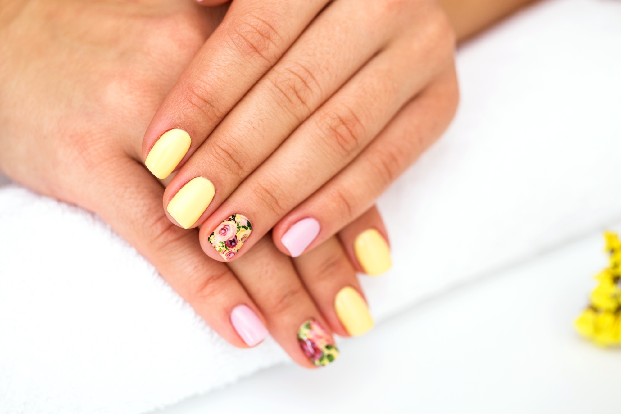 Woman in a nail salon receiving a manicure