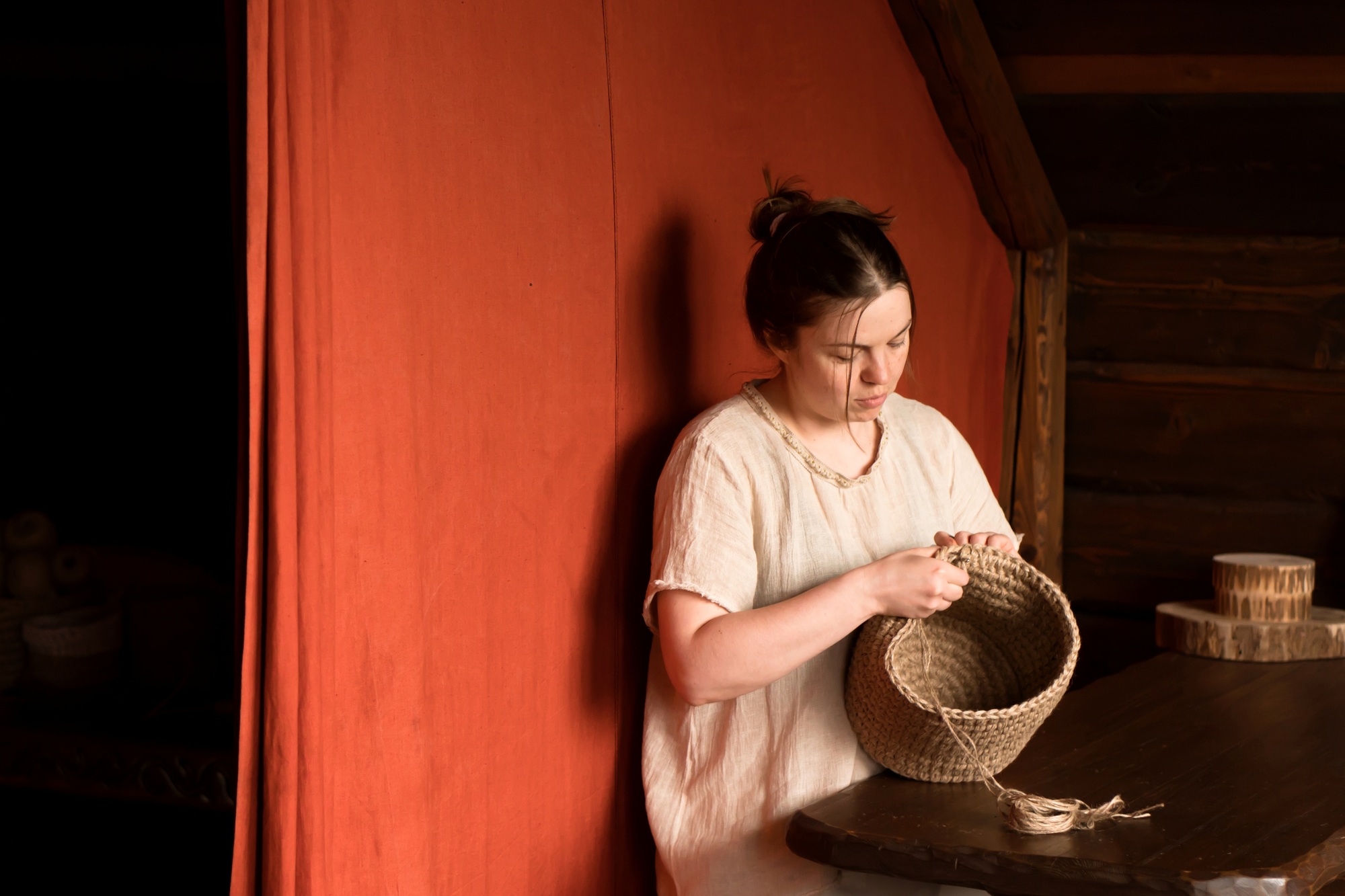 woman knitting basket of jute yarn crochet