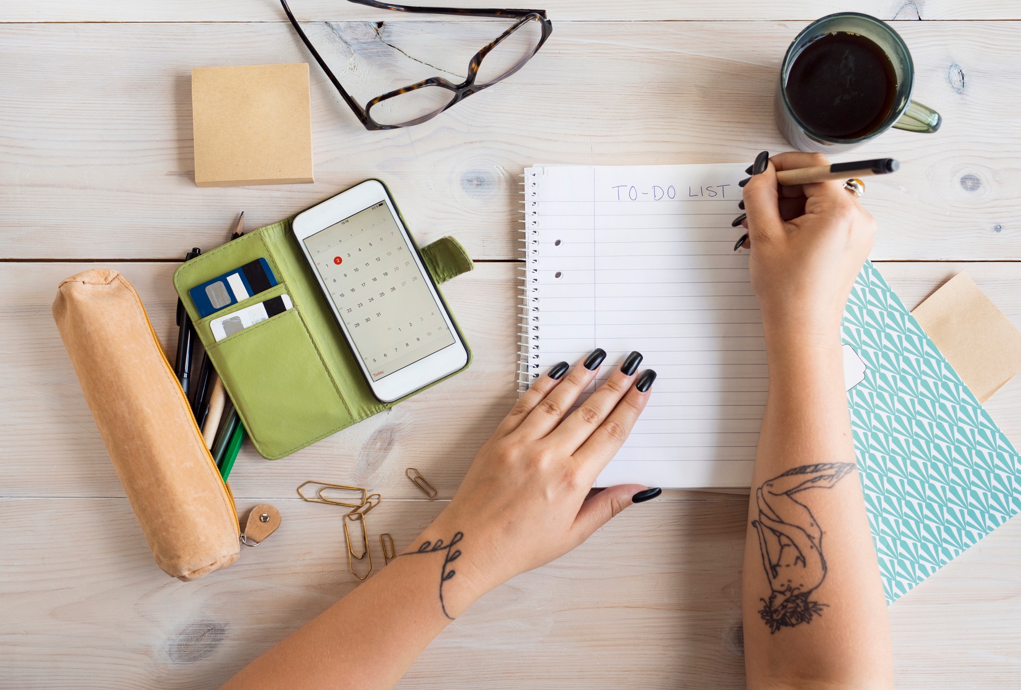 Woman preparing to-do-list in office