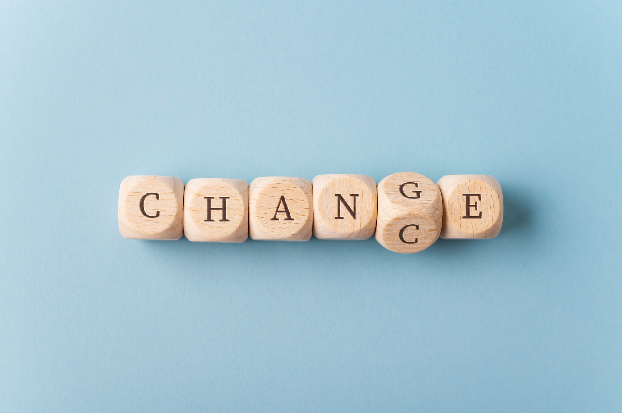 Word Change changing in to Chance spelled on wooden dices