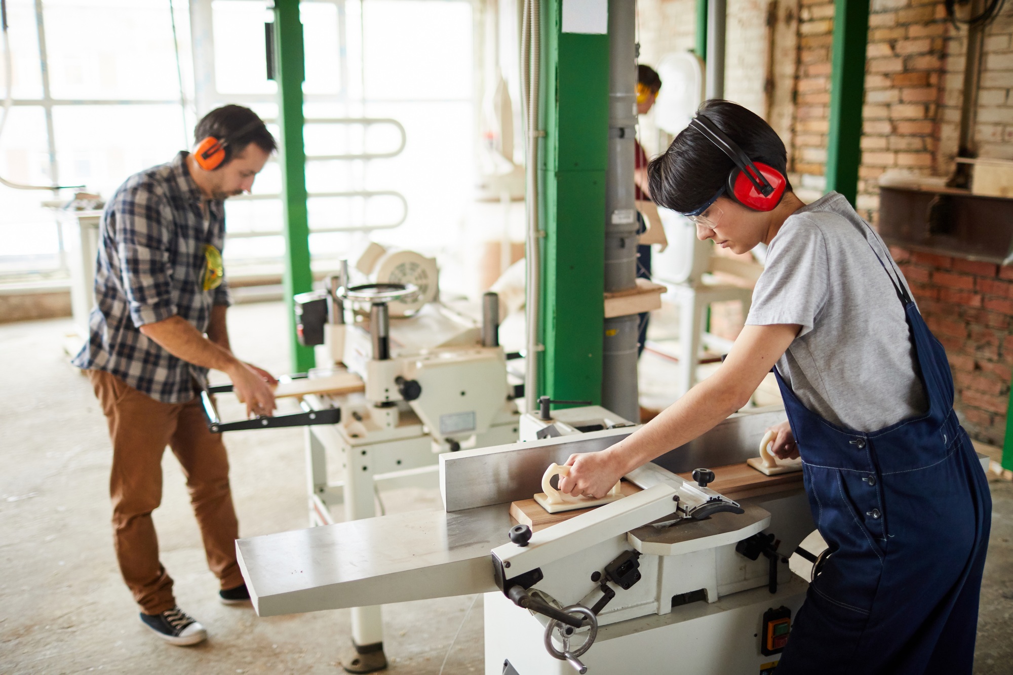 Workers Using Woodworking Machines