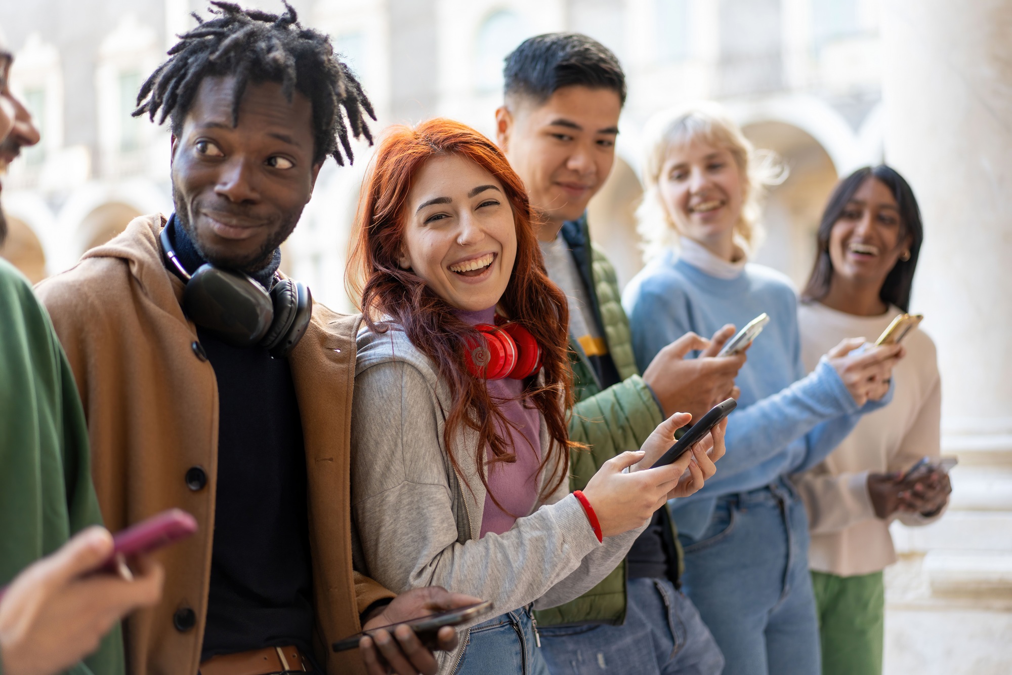 Young Friends Sharing Content on Smartphones