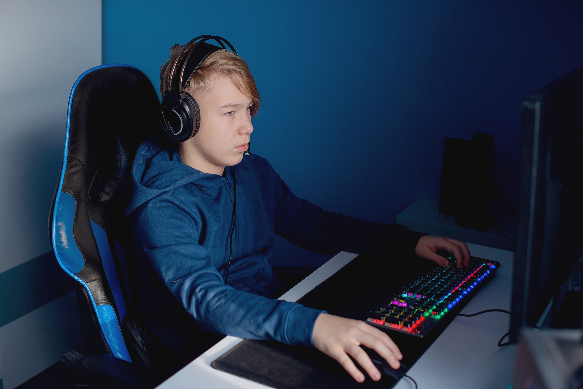 Young gamer playing online video games