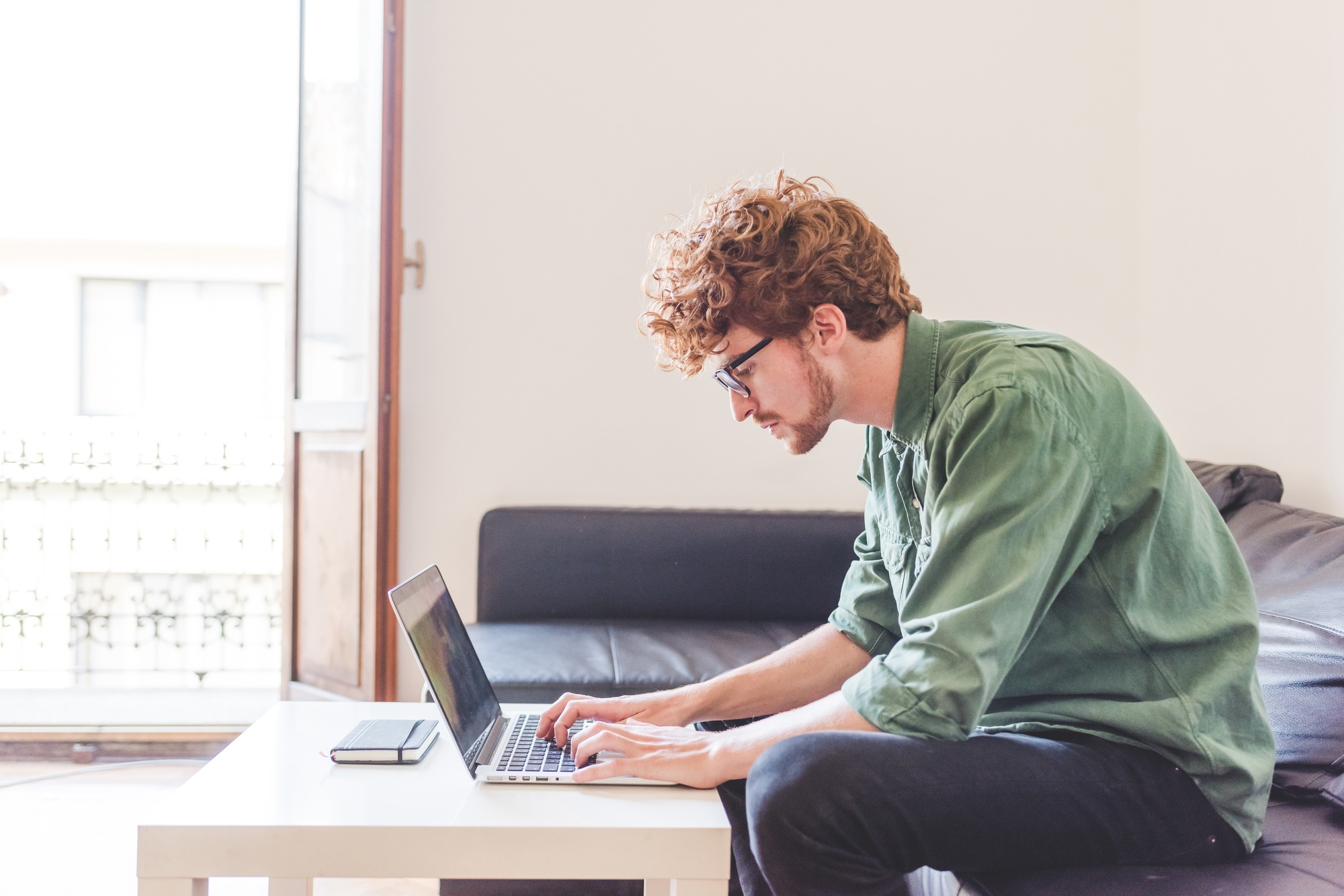 Young man business working computer at home