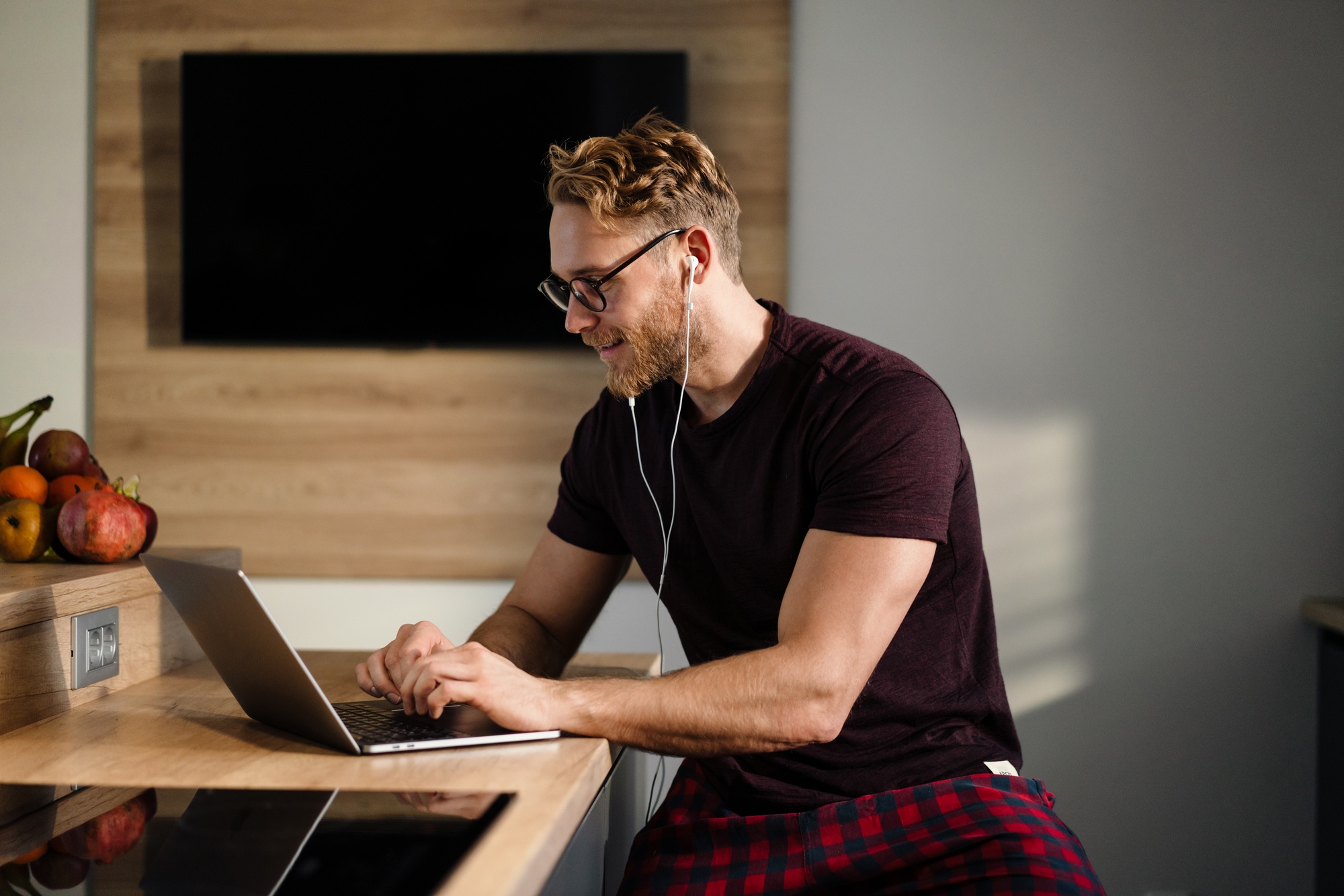 Young man working remotely and heaving a meeting