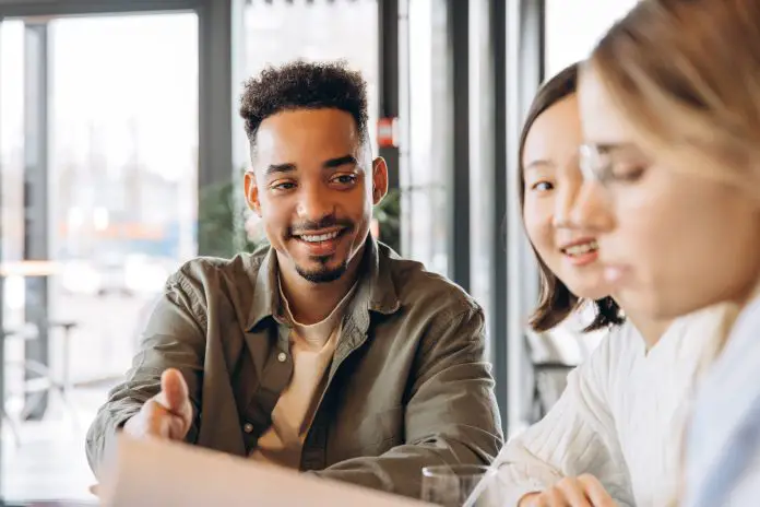 Young professionals collaborating on project in modern office space