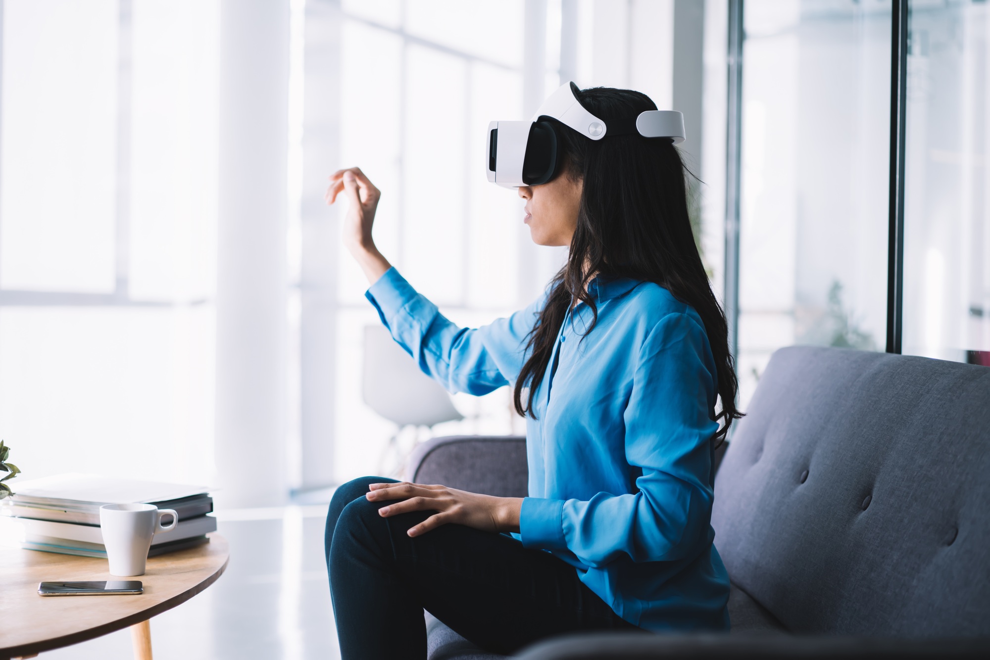 Young woman exploring virtual world
