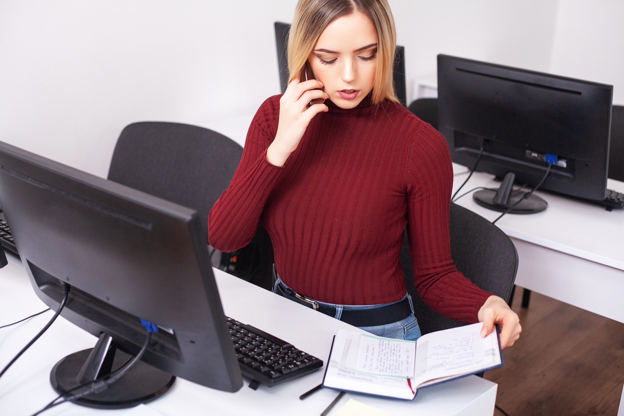 Young Woman Working And Programming On Computer In Office