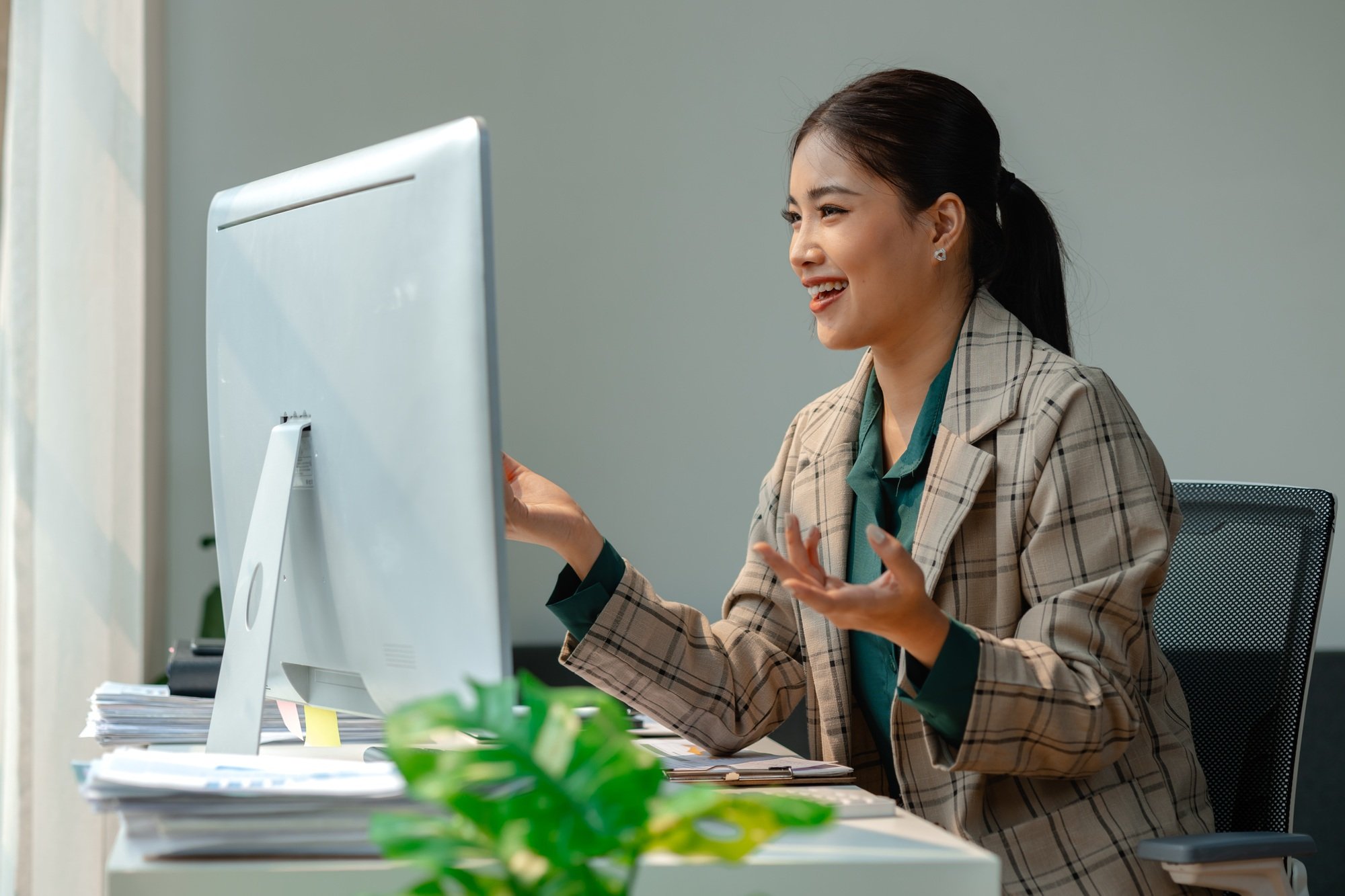 a businesswoman is attending video conference with her team to discussion about marketing strategy,