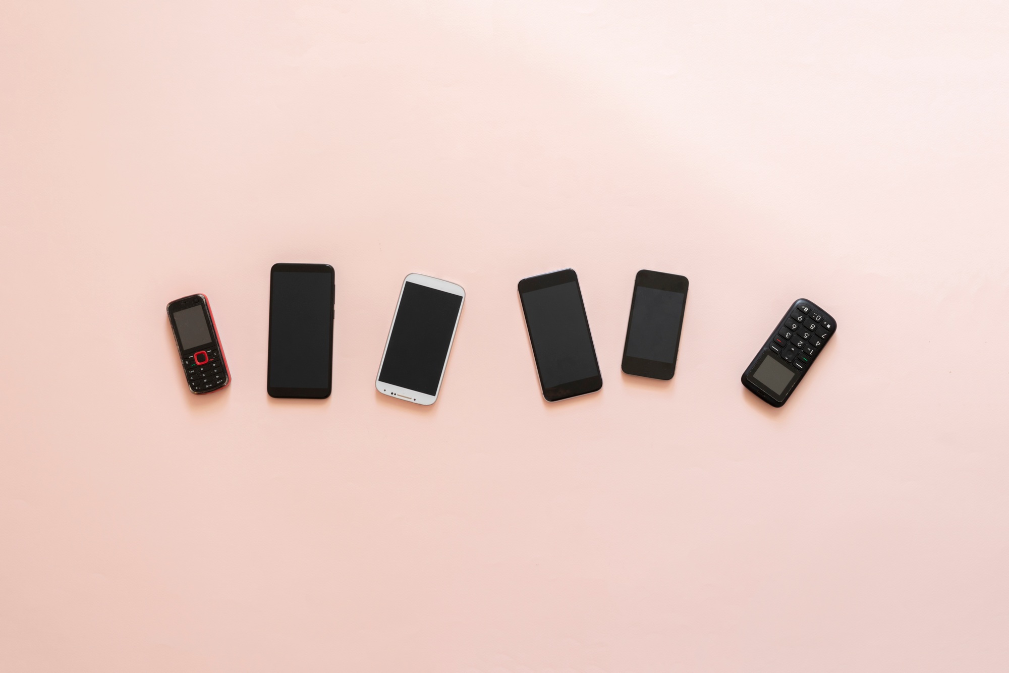 a technology evolution concept, some old vintage phone cell phones and new nodern devices