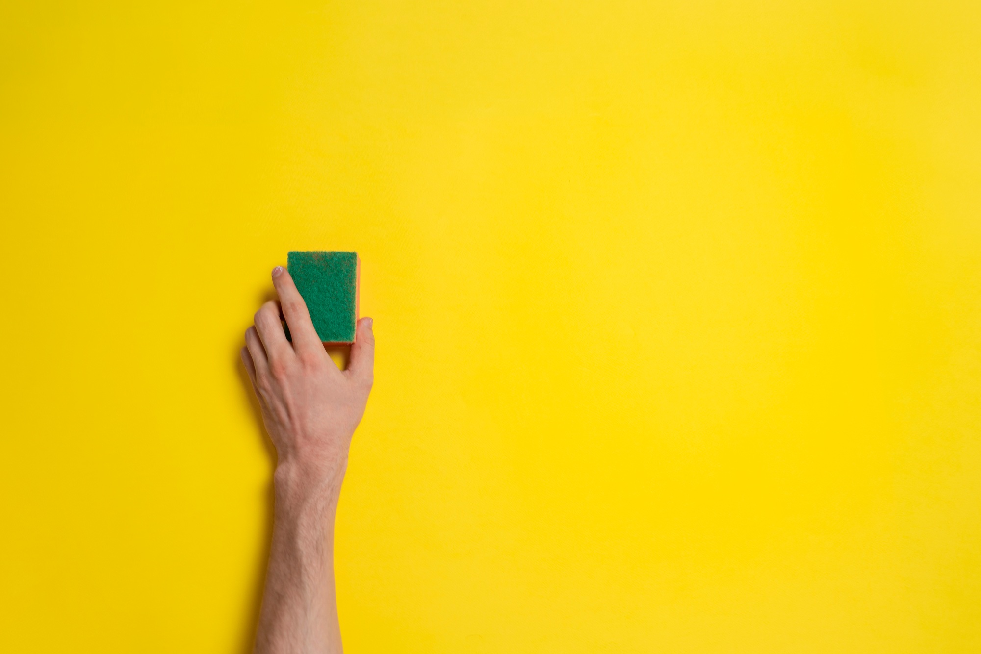 a template of hand with sponge cleaning the surface, concept of housekeeping
