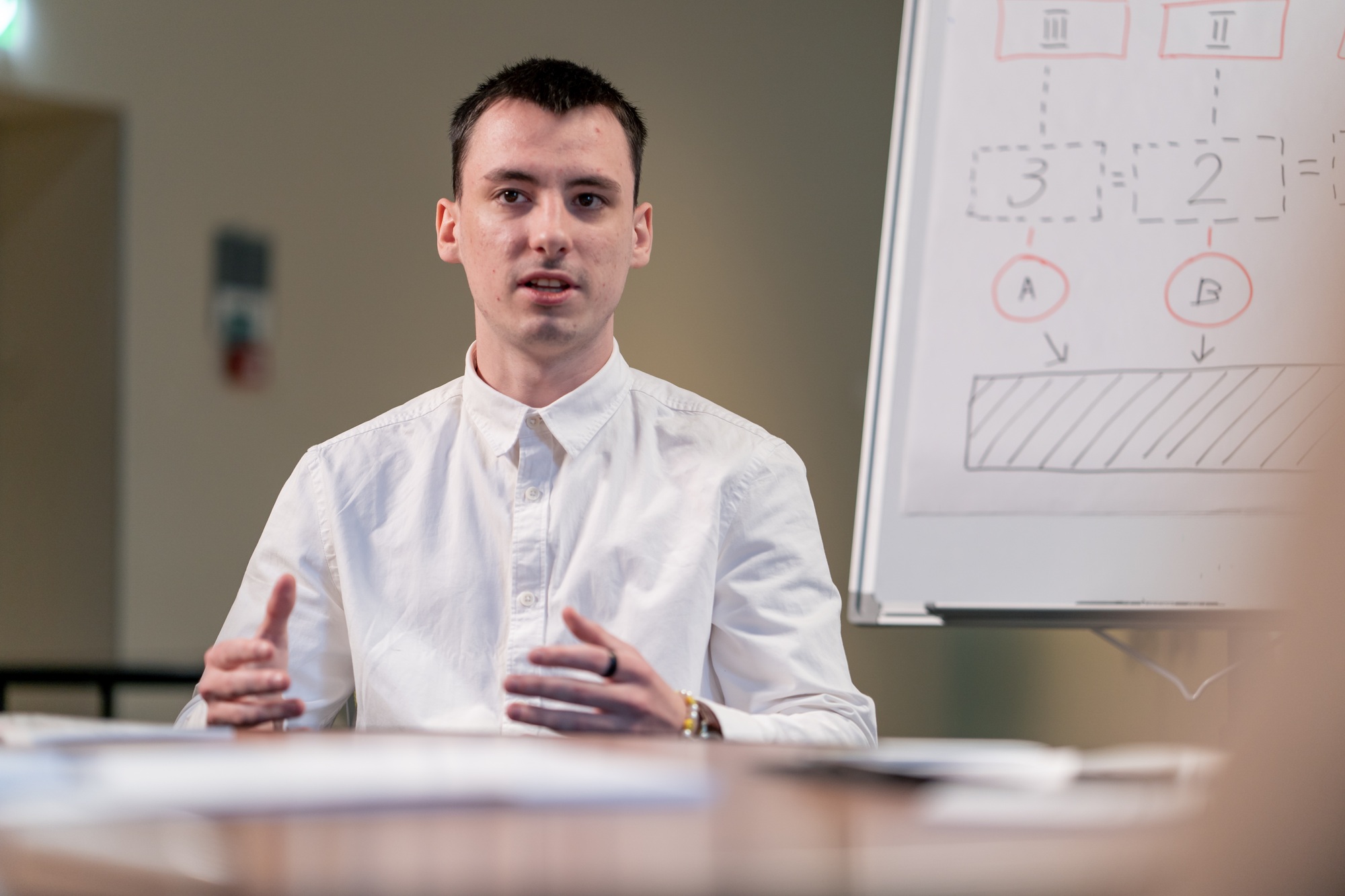 a young startup entrepreneur presents his business idea to the audience during a conference meeting