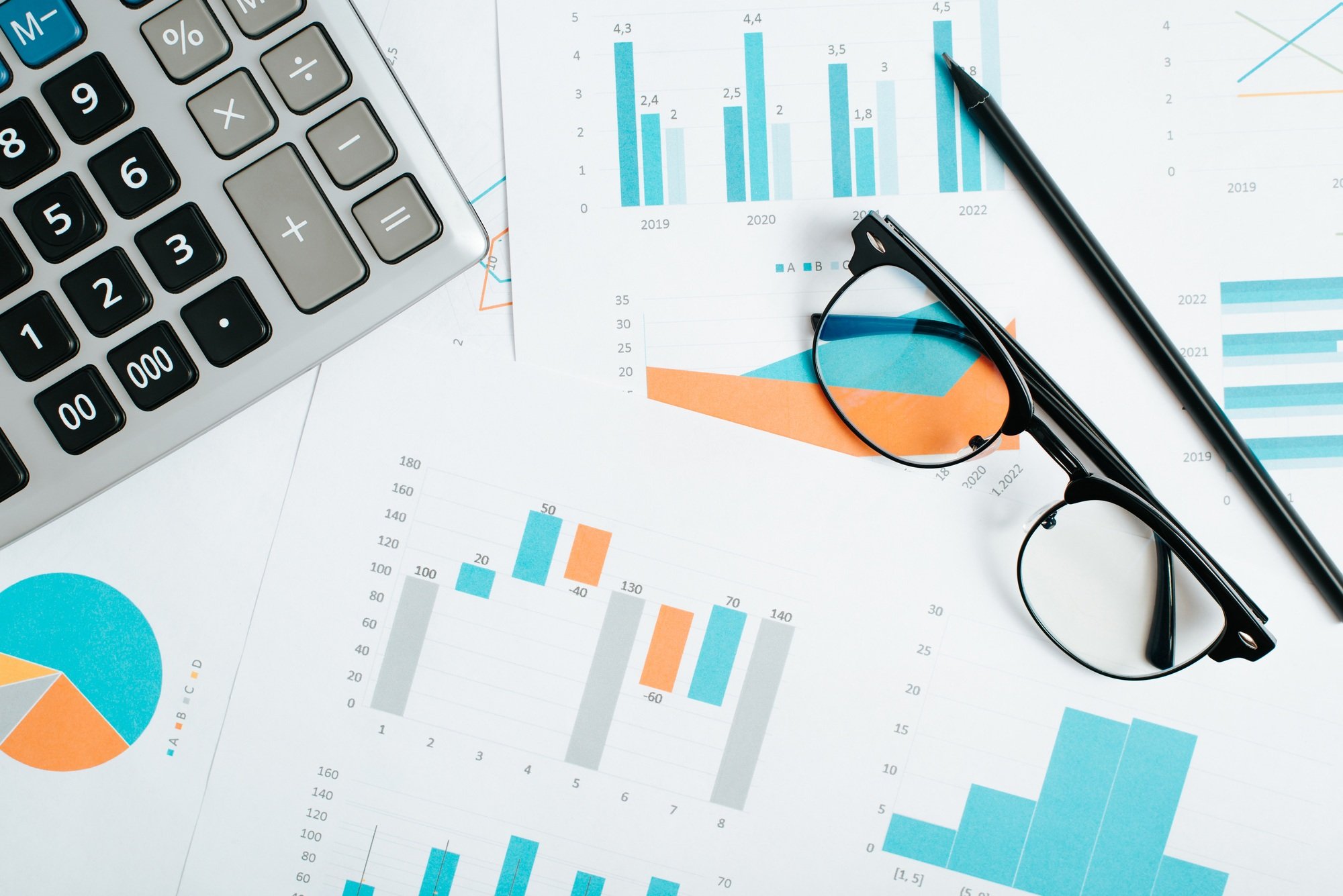 Accounting, business and finance concept. Calculator, glasses, pencil and financial