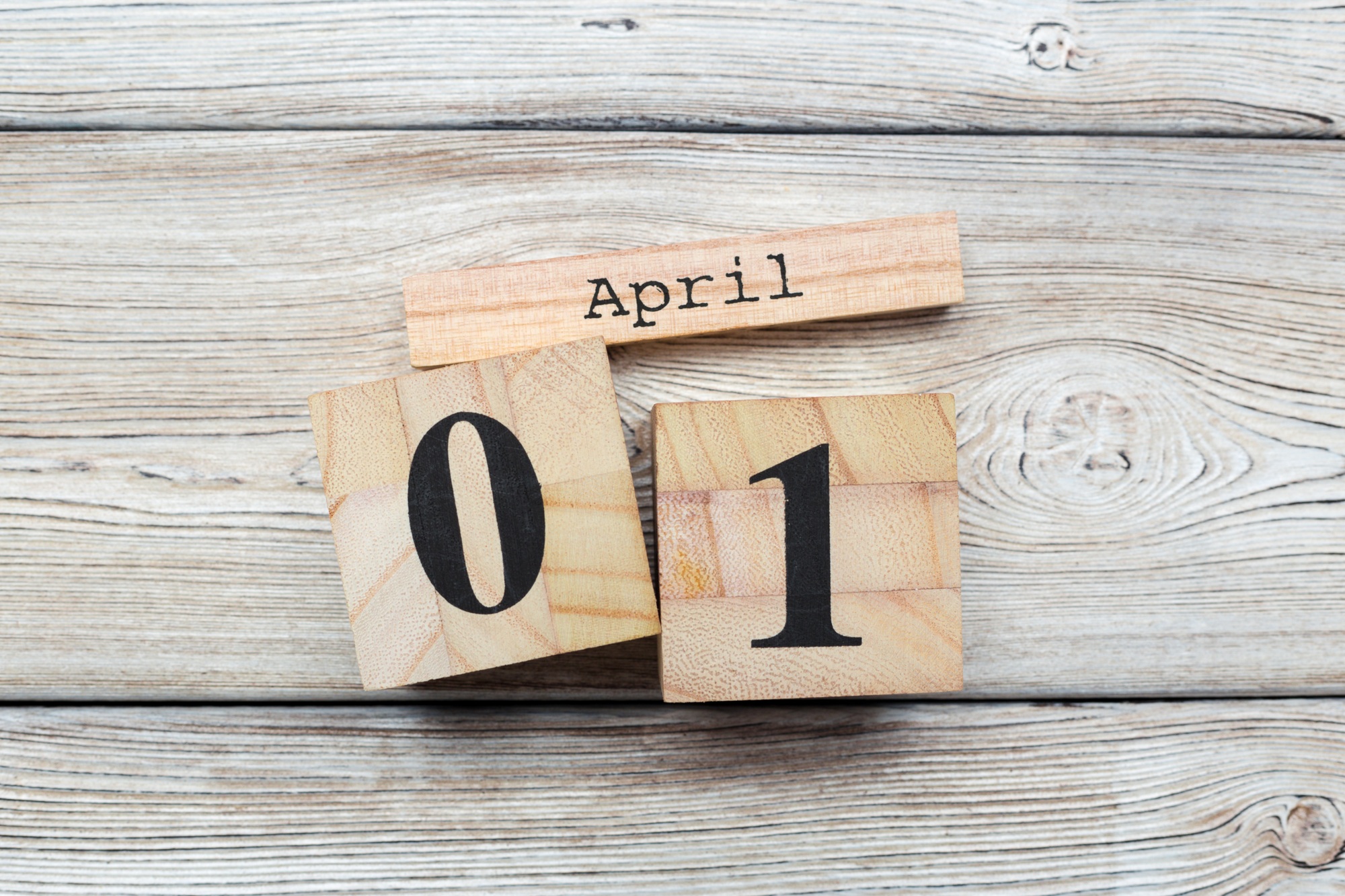 April 1st. Image of april 1 wooden color calendar on wooden background. Spring day