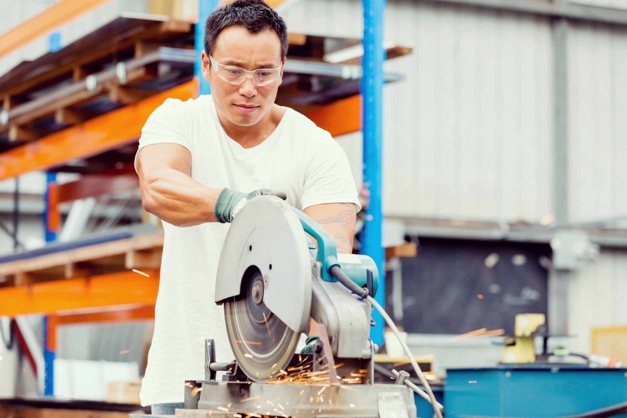 Asian worker in production plant on the factory floor